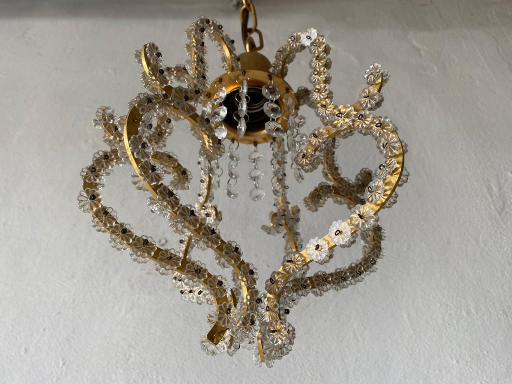 Brass & glass flower beads ceiling lamp by Emil Stejnar for Rupert Nikoll, 1950s

Mid-Century Modern charming pendant lamp.

Designed by Emil Stejnar for Rupert Nikoll
Manufactured in Austria

Lampshade is in perfect condition.
Beads made of