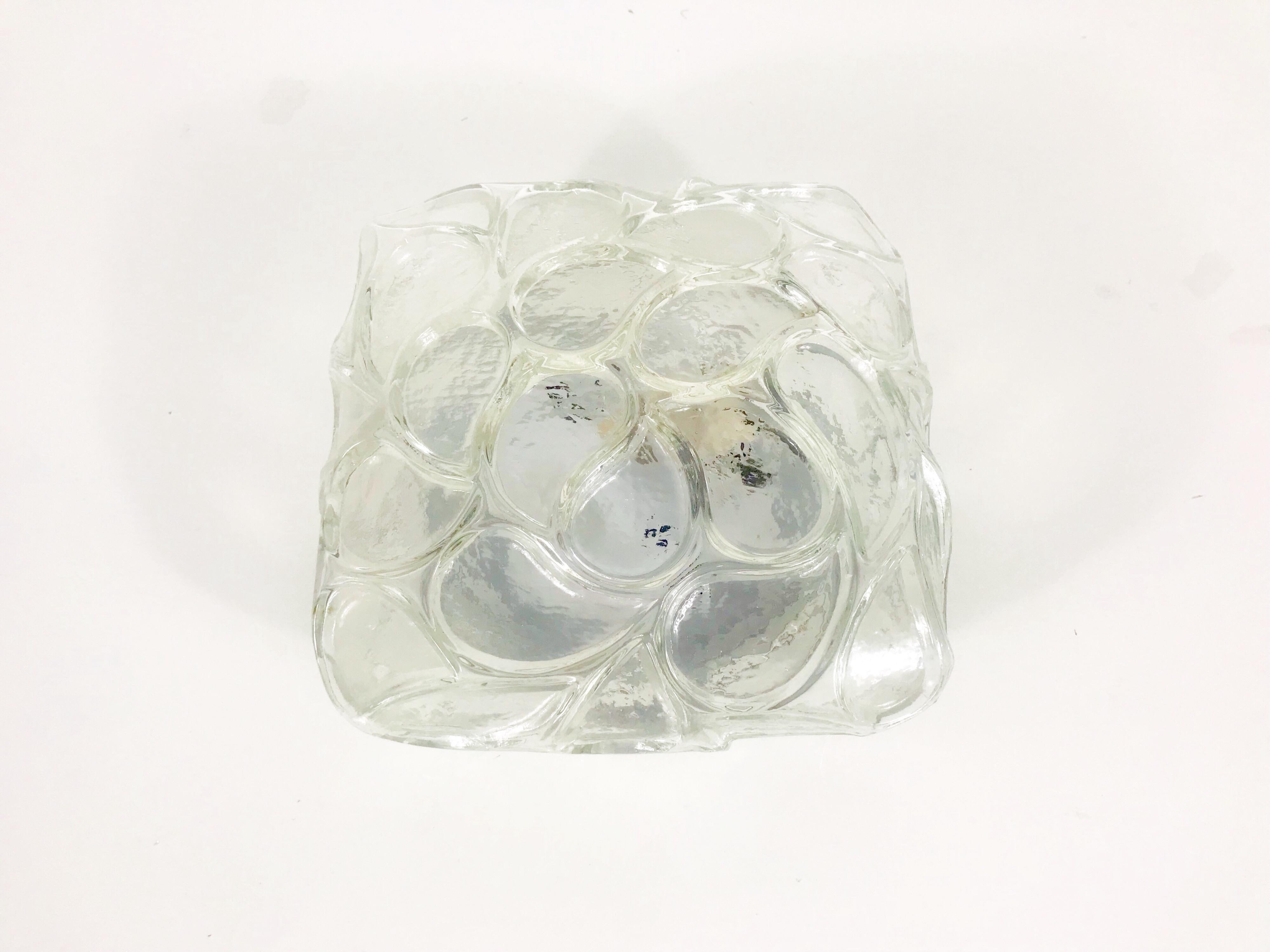 A glass flush mount by Glashütte Limburg made in Germany in the 1960s. It is fascinating with its rare glass shape which is similar to a flower design. You can use the light as a sconce or as a flush mount.

Measurements:

Height 11