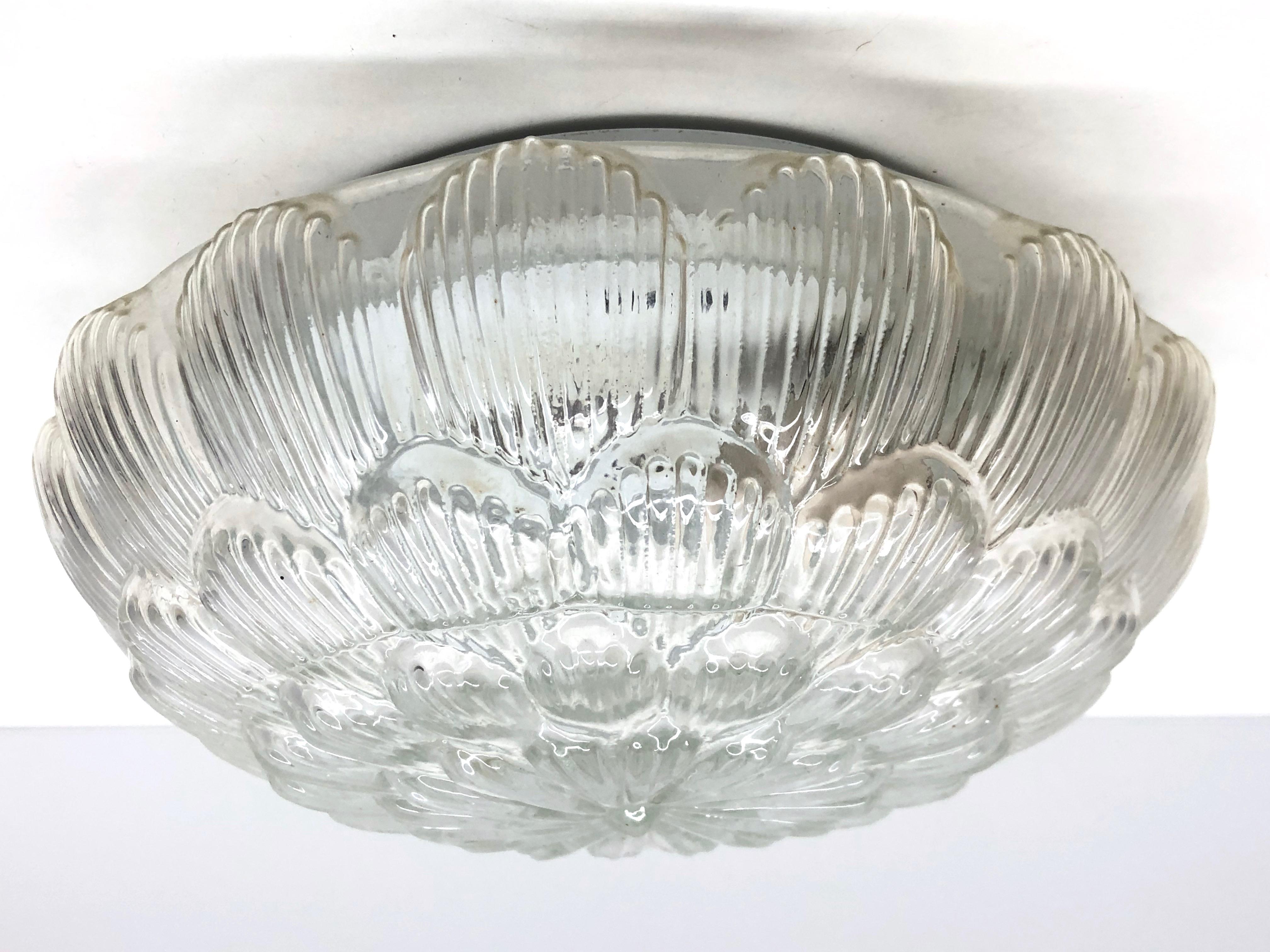 A beautiful flush mount by Massive Leuchten, Germany. Gorgeous textured glass flush mount with metal fixture. The fixture requires one European E27 Edison or medium bulb up to 60 watts.