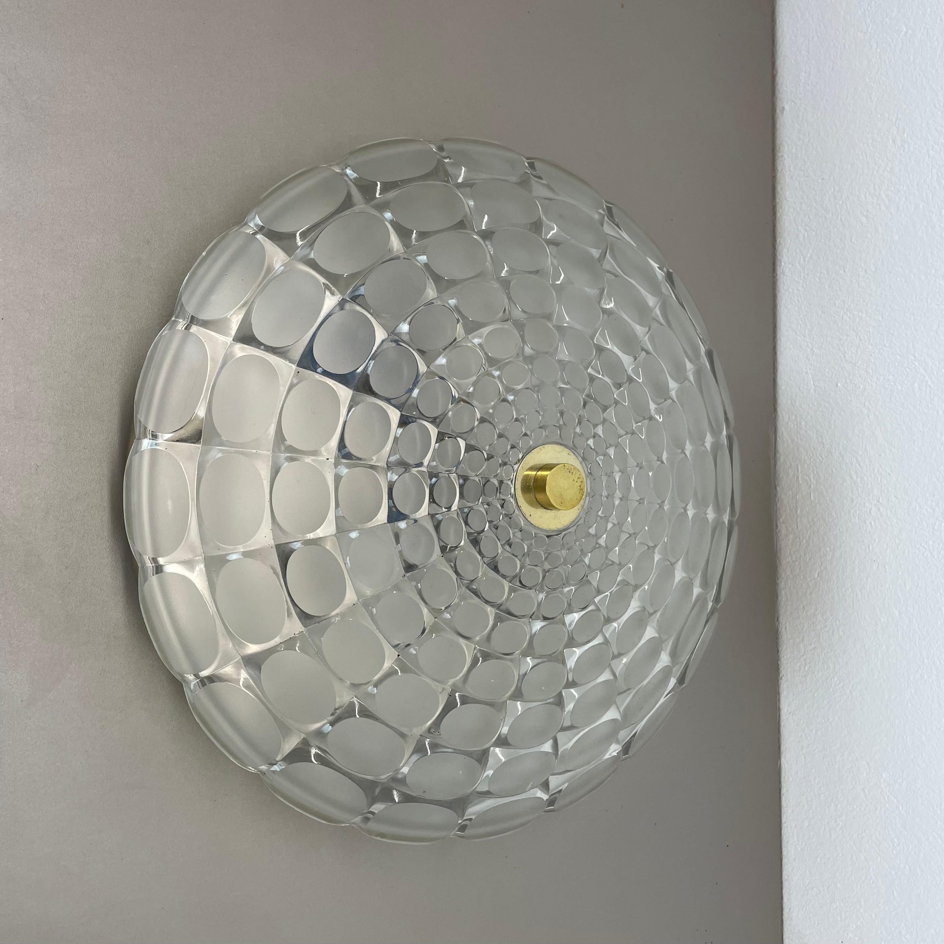 Article:

Wall light sconce, also useable as ceiling light


Origin:

Germany



Age:

1970s



This original modernist light was produced in Germany in the 1970s by Peill and Putzler Lighting (attrib.). It is made from heavy glass and has a metal