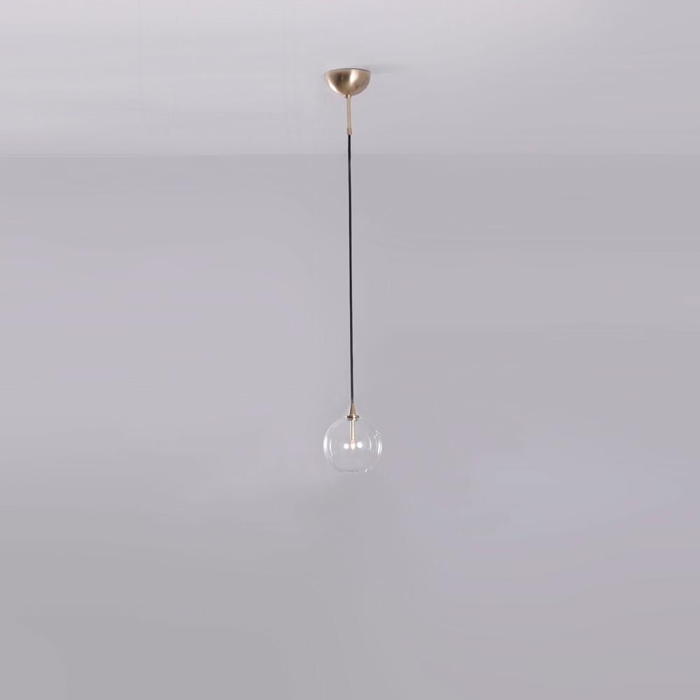 Glass globe 15 pendant light by Schwung
Dimensions: D 15 x W 15 x H 333.8 cm 
Materials: solid brass, mouth-blown glass globes.
Finish: natural brass. 
Available in finishes: polished nickel or black gunmetal. 
All our lamps can be wired