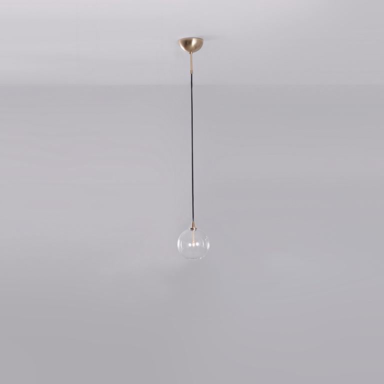 Glass Globe 25 pendant light by Schwung
Dimensions: W 25 x D 25 x H 344 cm
Materials: Natural brass, hand blown glass globes

Finishes available: Black gunmetal, polished nickel

Schwung is a German word, and loosely defined, means energy or