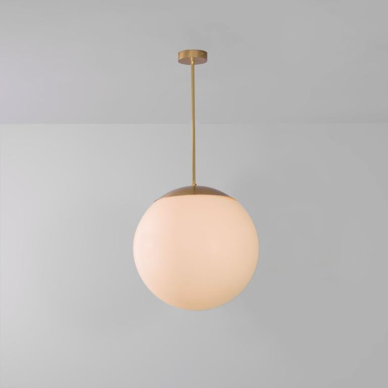 Glass globe opal 50 pendant light by Schwung
Dimensions: W 50 x D 50 x H 105 cm
Materials: Natural brass, hand blown glass globes

Finishes available: Black gunmetal, polished nickel

Schwung is a German word, and loosely defined, means energy or