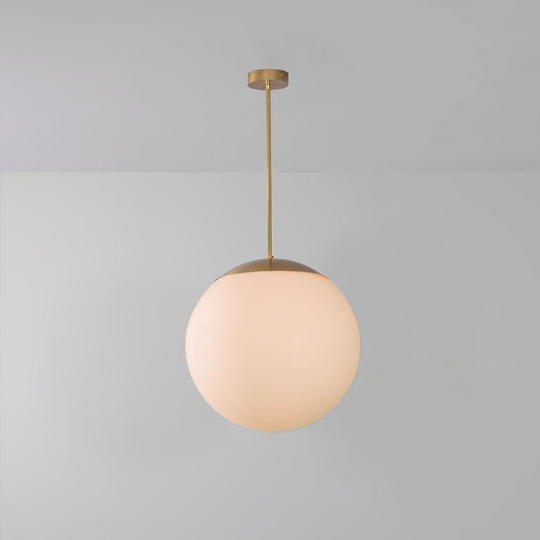 Glass globe opal 50 pendant light by Schwung
Dimensions: W 50 x D 50 x H 105 cm
Materials: Natural brass, hand blown glass globes

Finishes available: Black gunmetal, polished nickel

Schwung is a German word, and loosely defined, means energy