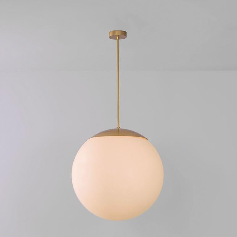 Glass globe opal 60 pendant light by Schwung
Dimensions: W 60 x D 60 x H 125 cm
Materials: Natural brass, hand blown glass globes

Finishes available: Black gunmetal, polished nickel.

 Schwung is a german word, and loosely defined, means