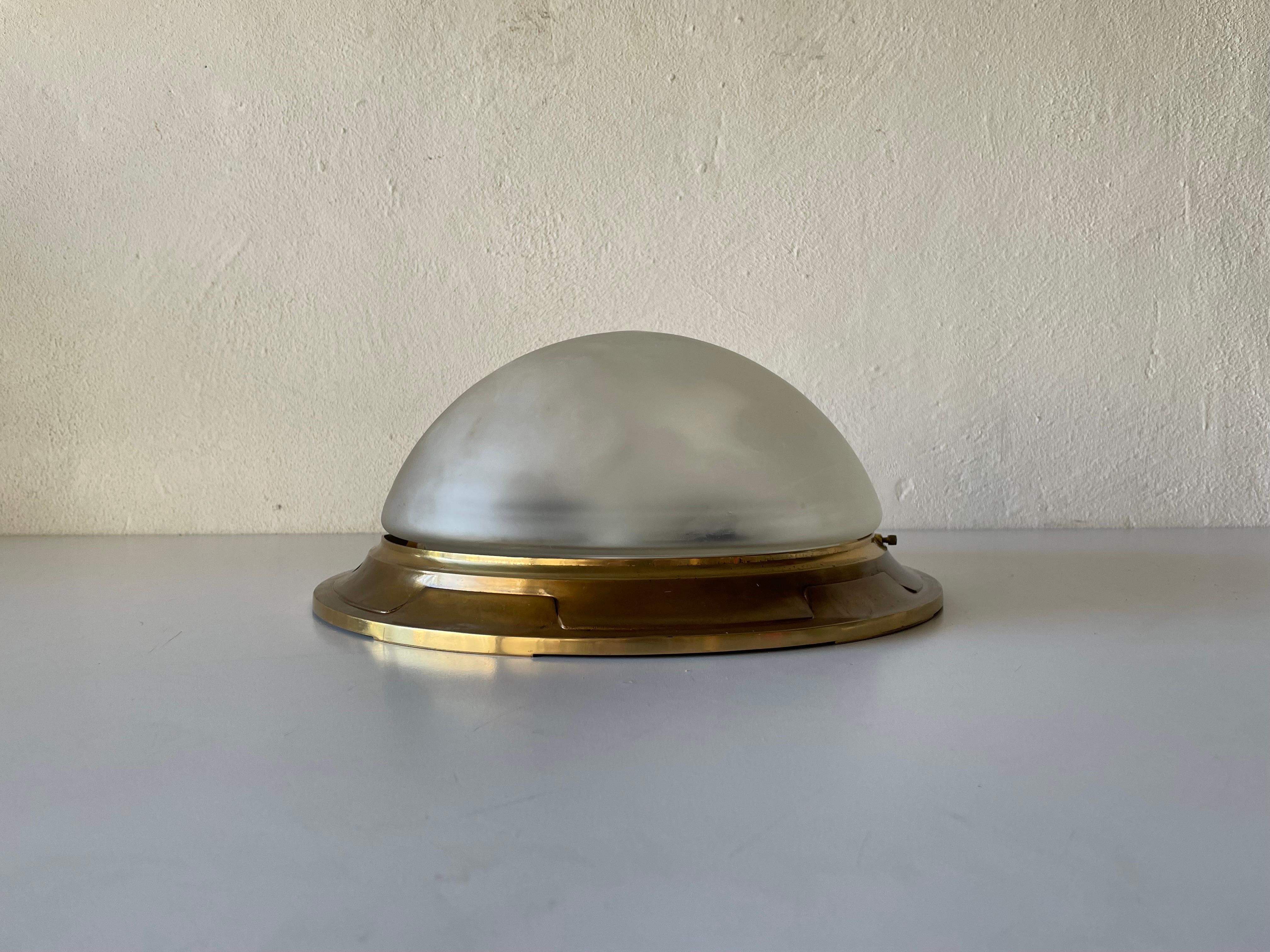 Glass & Heavy Brass Base Ceiling or Wall Lamp by Mod Dep Lamp Art, 1960s, Italy

Lampshade is in very good vintage condition.

This lamp works with 2x E27 light bulbs. 
Wired and suitable to use with 220V and 110V for all
