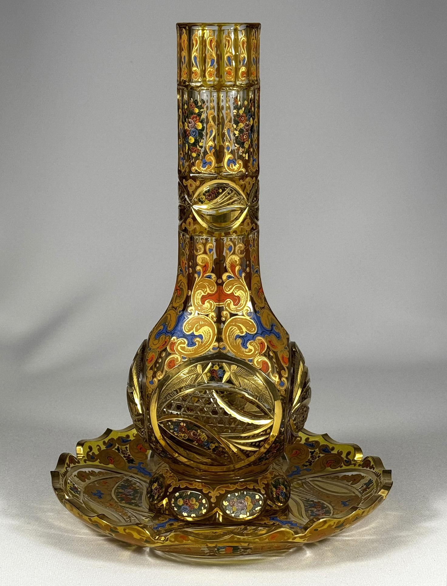 This hookah base and plate is made of clear glass, designed specifically for the Persian market. The clear glass is covered with an amber layer, The circular body is decorated with intricate painting and skillful glass cutting, which highlights the