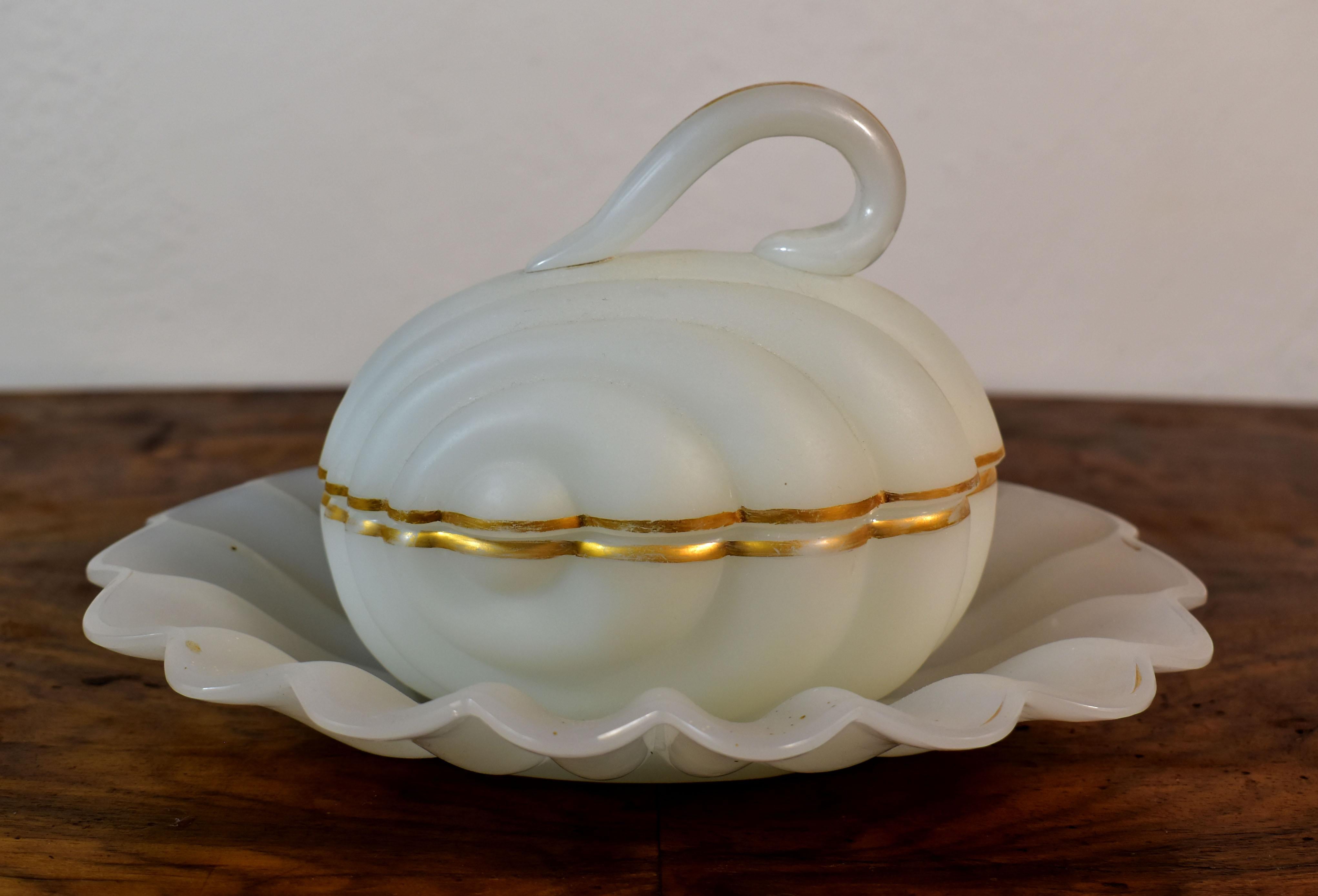 A beautiful shell-shaped glass jar with a plate, It is an opaline white glass , Opaline glass was very popular in the 19th century and is also interesting as a collector , it is the hand-blown work of glass masters complete with gold painting , The
