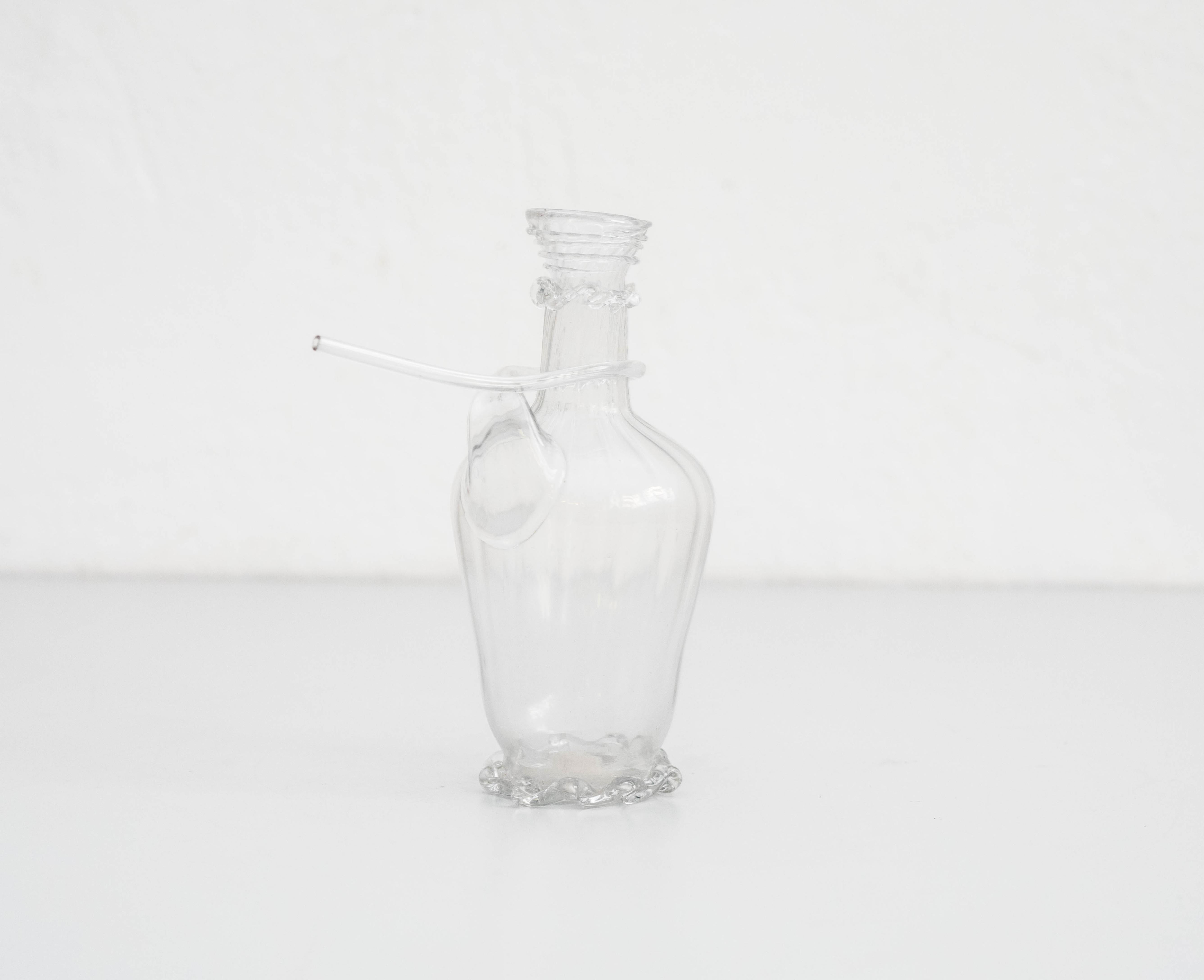 Glass jug, circa 1930 
Manufactured in Spain.

In original condition, with minor wear consistent of age and use, preserving a beautiful patina.

Material:
Glass

Dimensions:
 D 9 cm
 W 16 cm
 H 20 cm

 