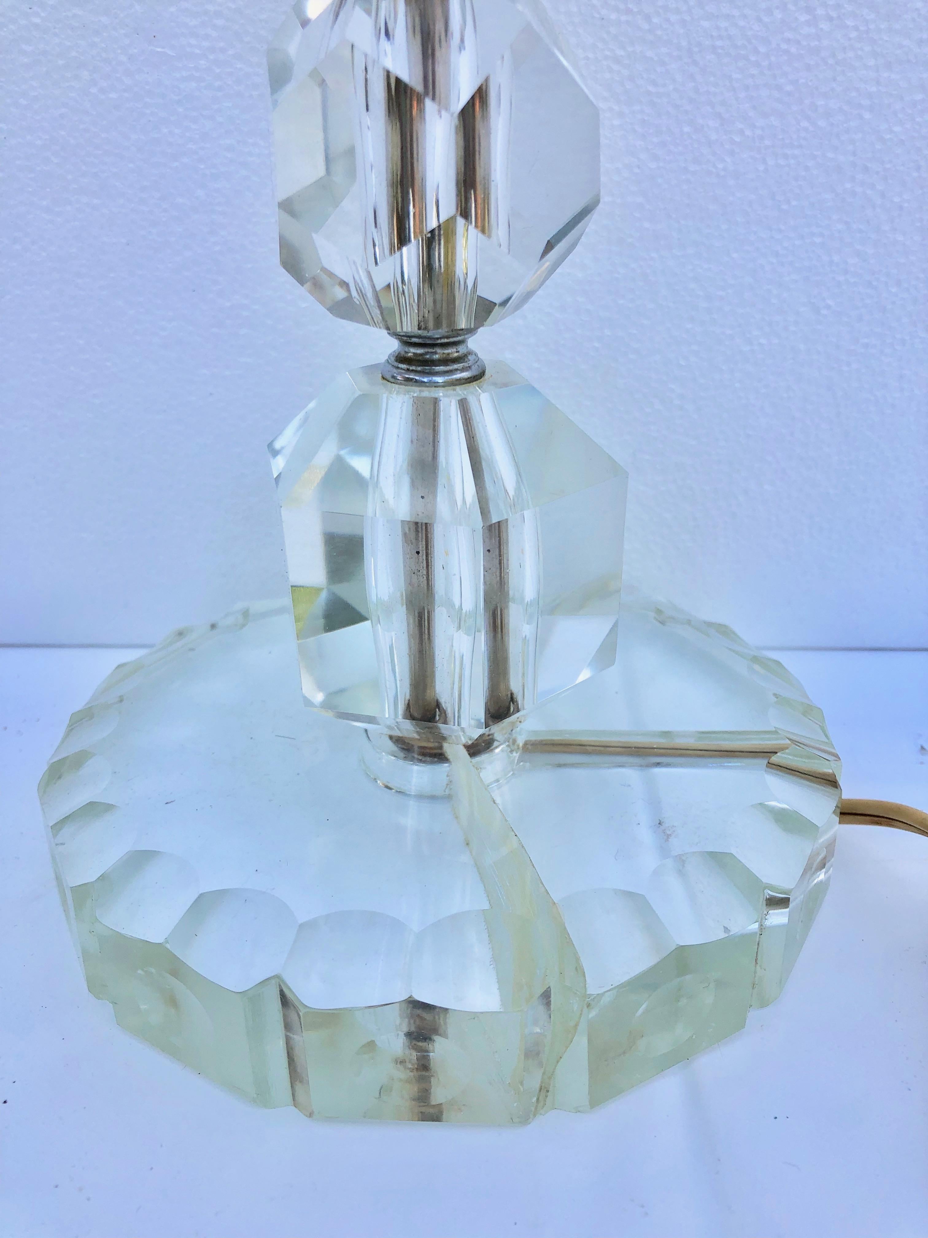 This is a lovely glass lamp with French antique hanging crystals. It comes with its shade support and is wired for USA. It is a tall lamp which could support a substantial shade. It would add elegantly lighting to a living room, hall or