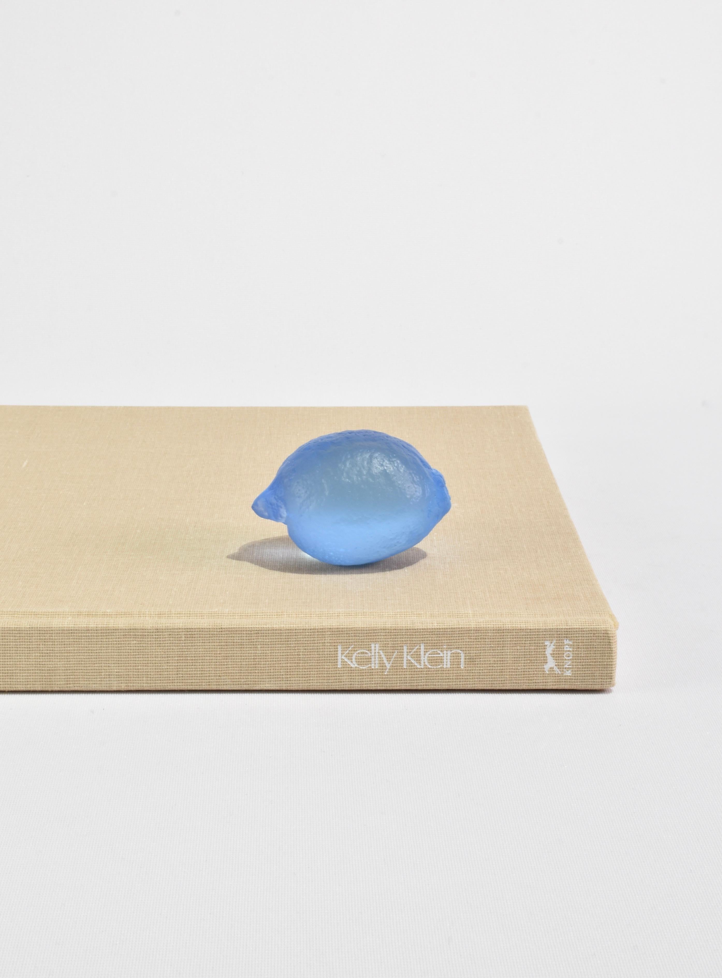 Sculptural glass lemon, handmade in Auckland, New Zealand by artist Devyn Ormsby. Individually cast from a true to size lemon into a solid, crystal glass form.

Each lemon is a personal work of art that catches and reflects light in a way that makes