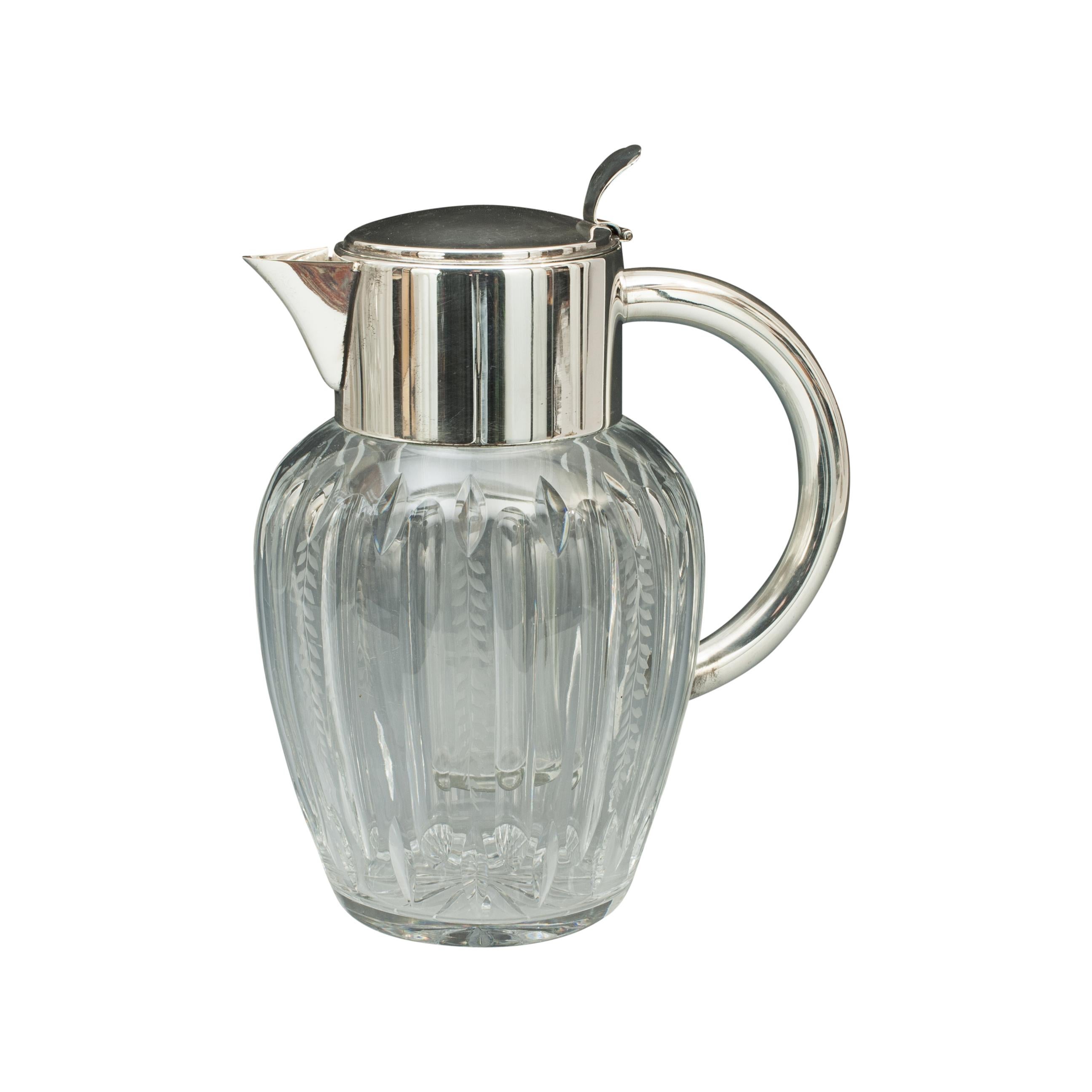 Vintage glass lemonade jug with cooler.
A very nice large lemonade jug with original internal cooling insert, this is the ideal way to keep your beverages chilled. The glass insert is filled with ice and put in place thus cooling the liquid inside,