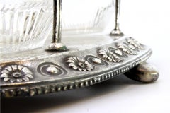 Glass liqueur/cruet set with two cut glass cruets on a silver frame