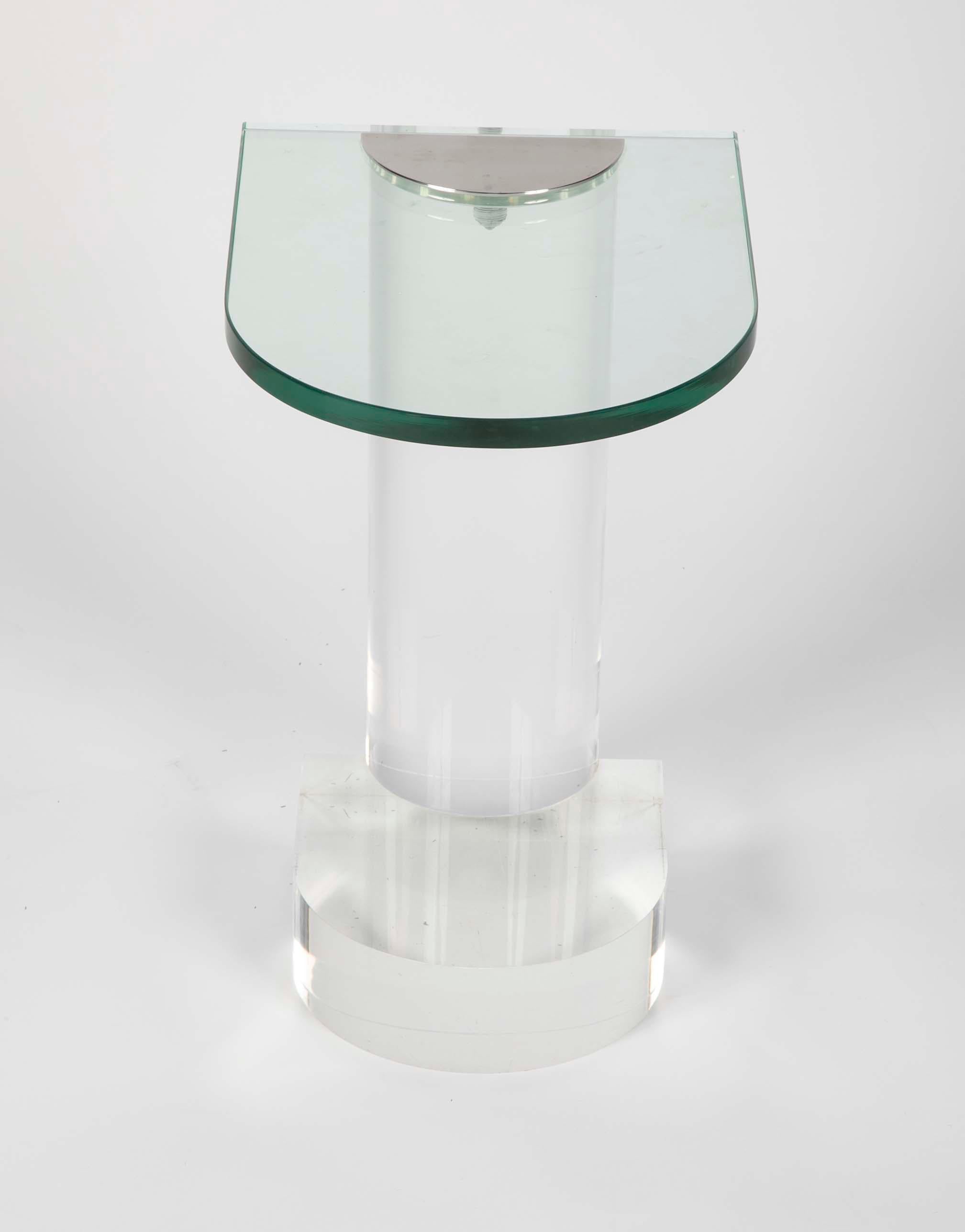 A side table in the manner of Karl Springer but attributed to Lorin Marsh. Lucite base with glass table and chromed metal hardware.