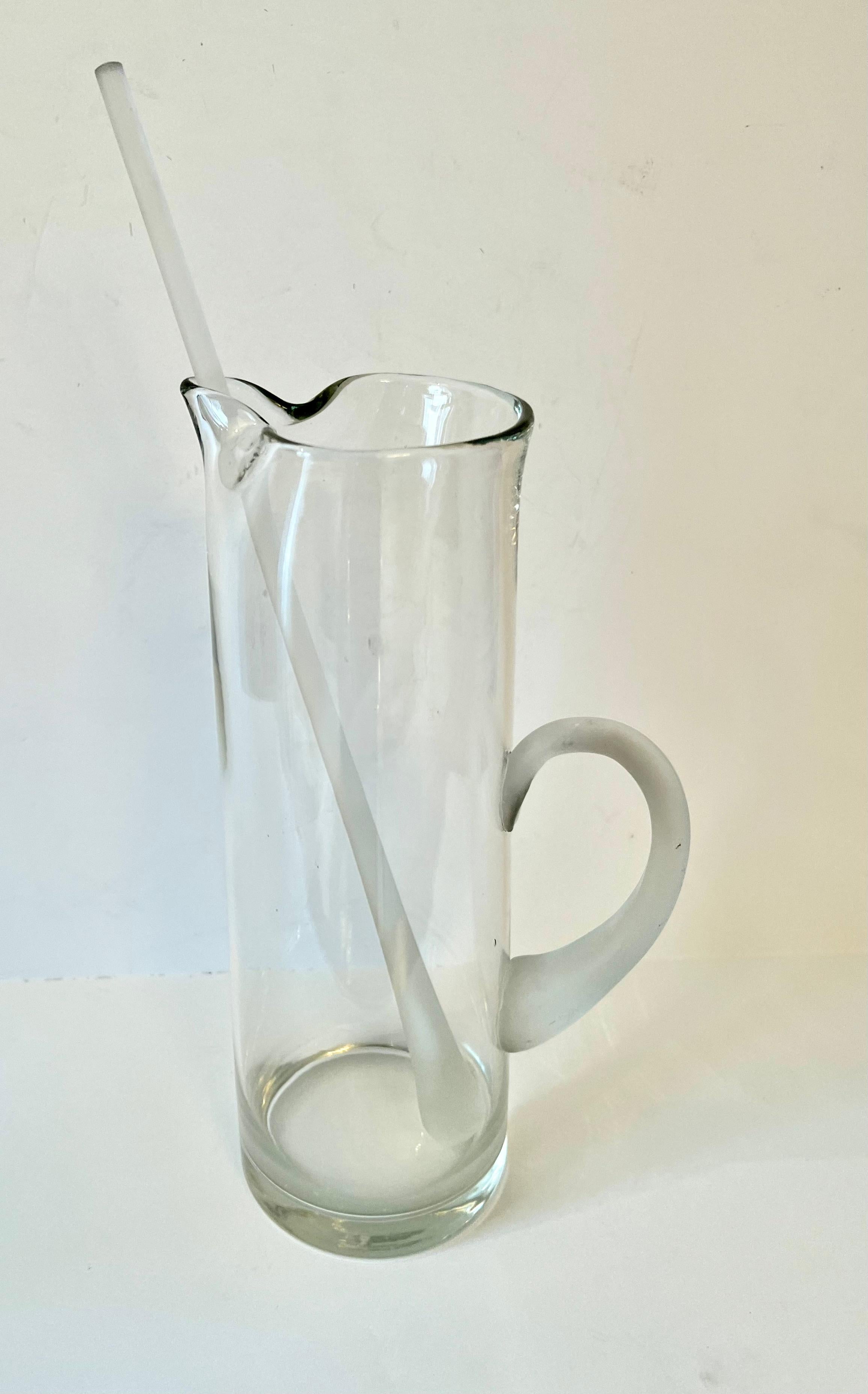 A wonderful tall Martini pitcher. The pitcher has a frosted handle and frosted stirrer... a compliment to many bars and also works well for juices and mixers... a lovely set and ready for your spirits - 

A great housewarming or wedding gift.