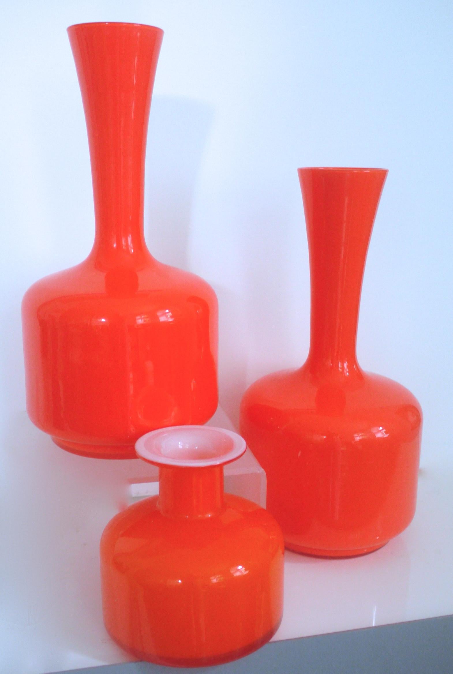 Glass Mid-Century Modern orange vases/pitcher - 1960s in style of Holmegaard/Aseda

One of the vessels has a small white inclusion 3mm approximately - in the style of Scandinavian Holmgaard possibly ASEDA 

Measures: Height 32 cms
Diameter 19