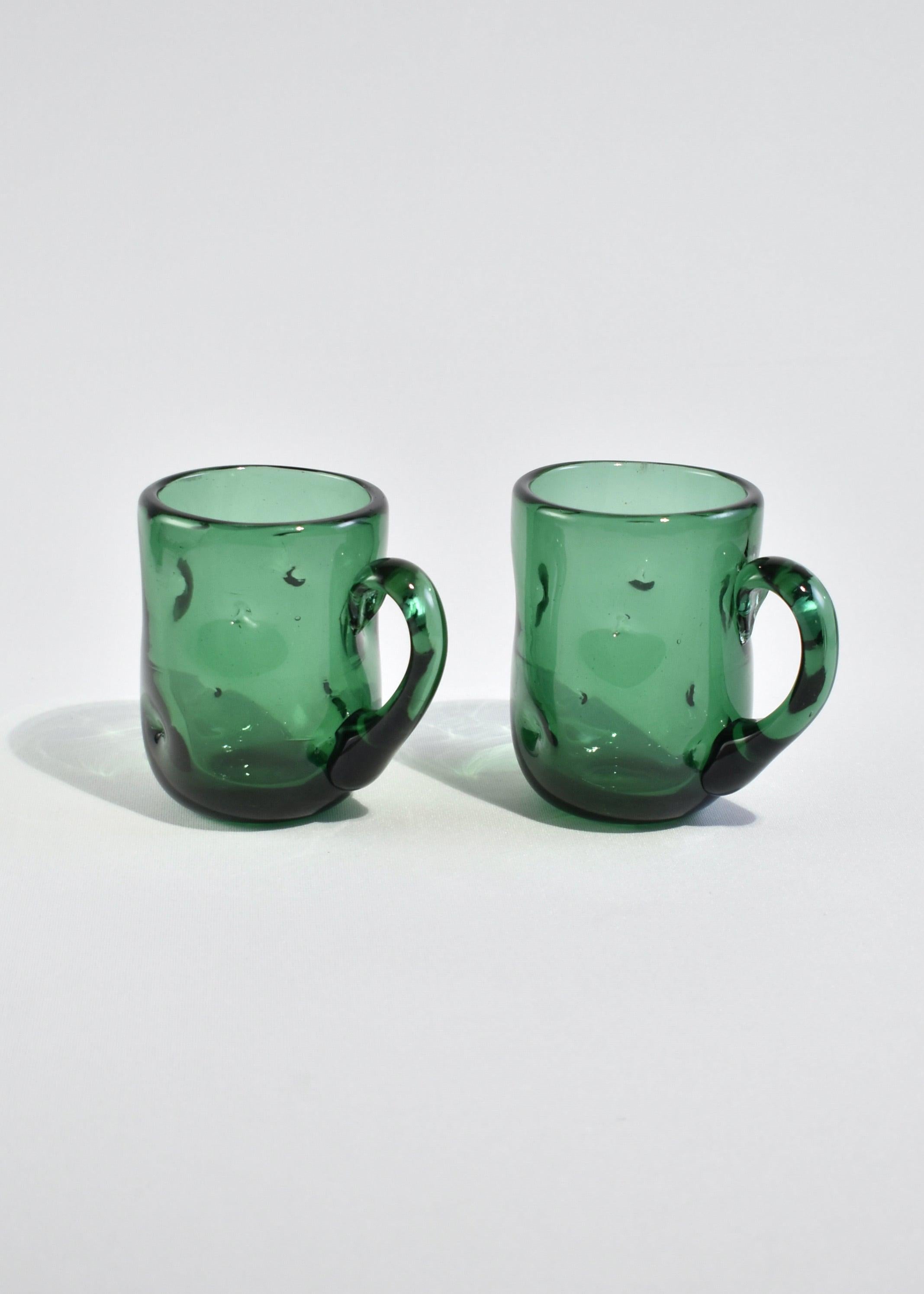 Vintage handblown organic shaped glass mug set in emerald green. Made by Blenko.