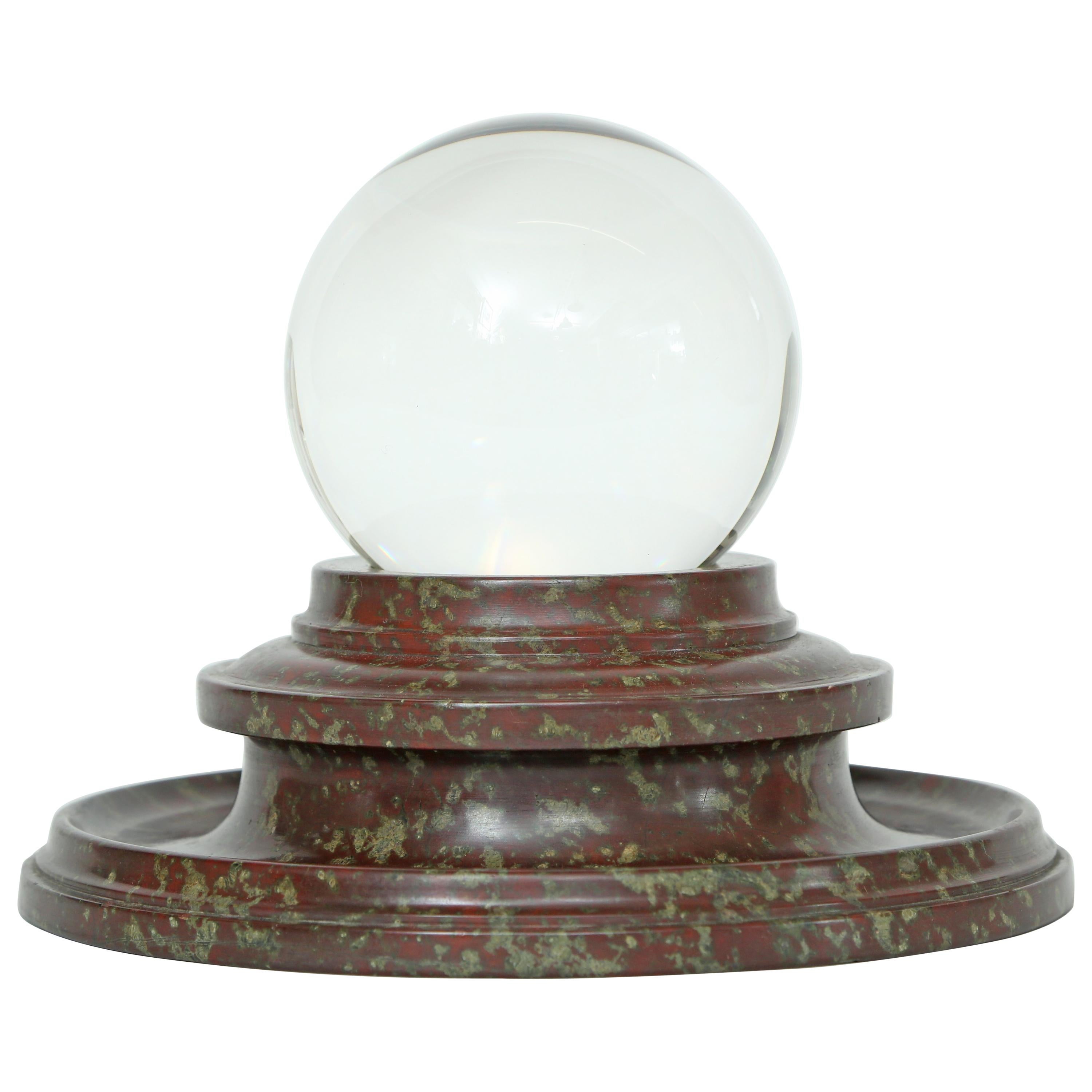 A Crystal Orb Adorning a Lathe Turned Marble Stand 
