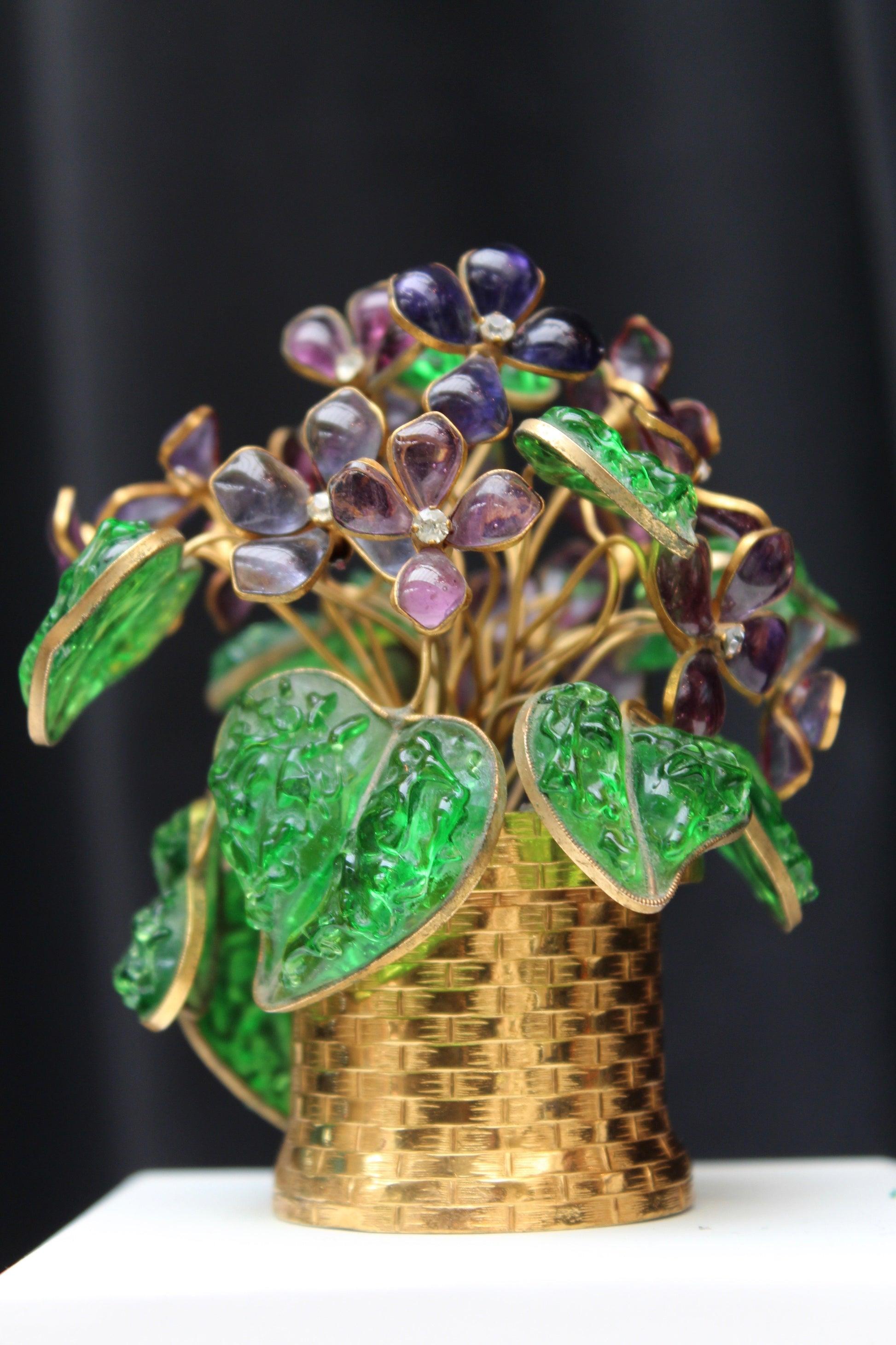Violet bouquet composed of glass paste. Originally, this bouquet was ordered by Maison Chanel as a gift to its most important clients. Circa 1960s.

Additional information:
Condition: Very good condition
Dimensions: Height: 11 cm (4.33