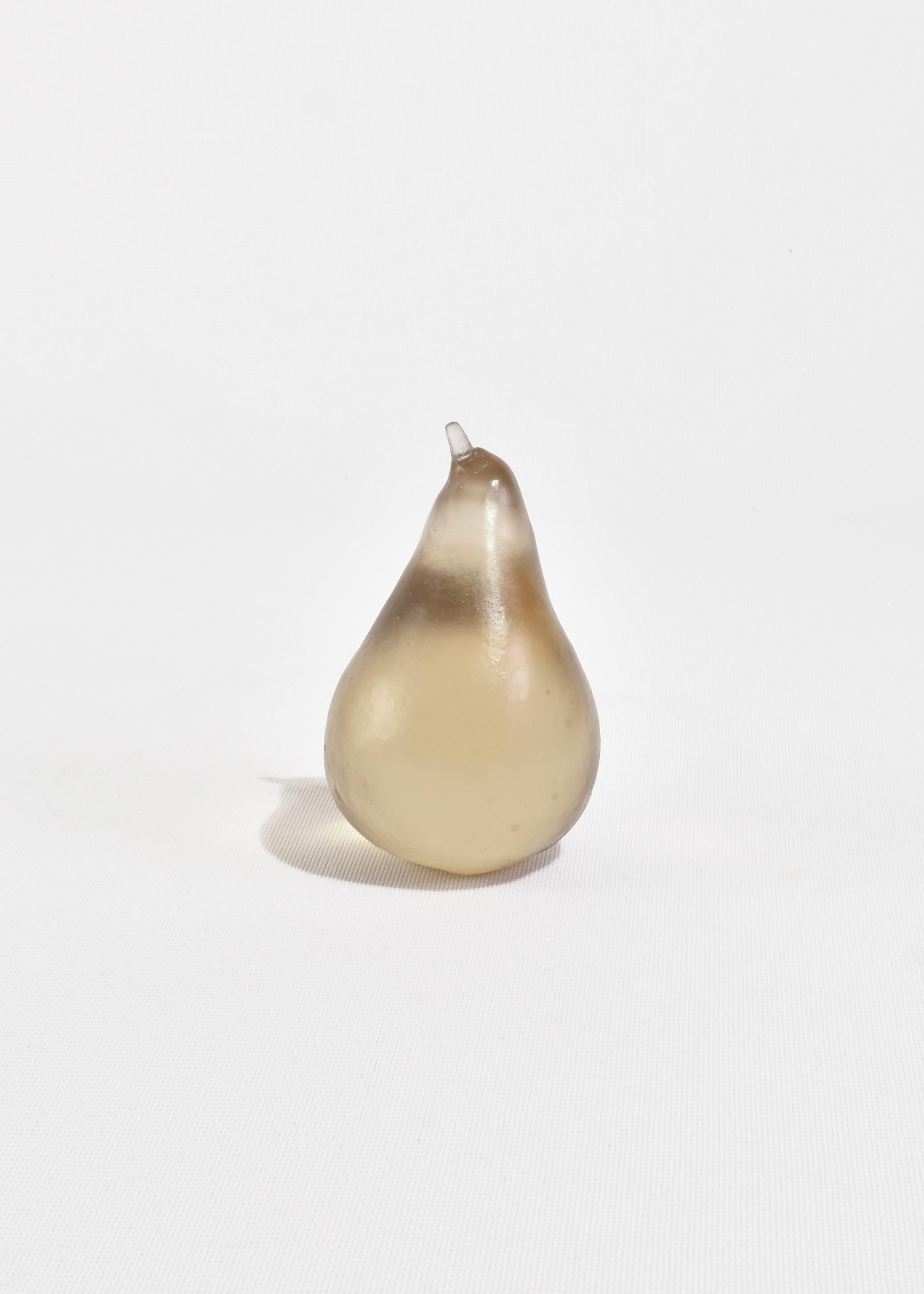Sculptural glass pear, handmade in Auckland, New Zealand by artist Devyn Ormsby. Individually cast from a true to size winter pear into a solid, crystal glass form.

The elegant pear shape catches and reflects light along its rounded contours. The