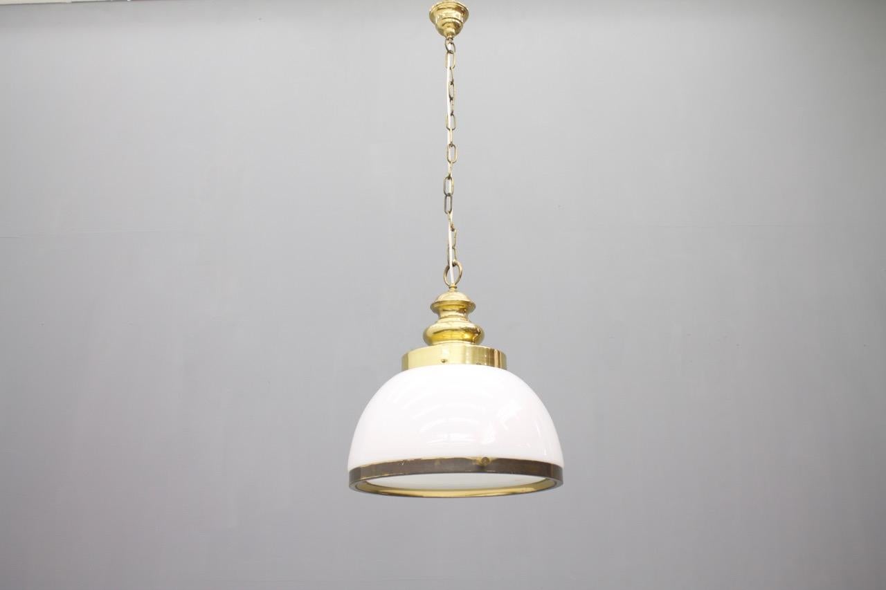 Glass pendant in brass and opaline glass. 
Very good condition with a nice patina.
Measurements:
Diameter 40 cm (15.7 inches), height 45 cm (17.7 inches) height with chain (can be shortened) 102 cm (40.1 inches).

 