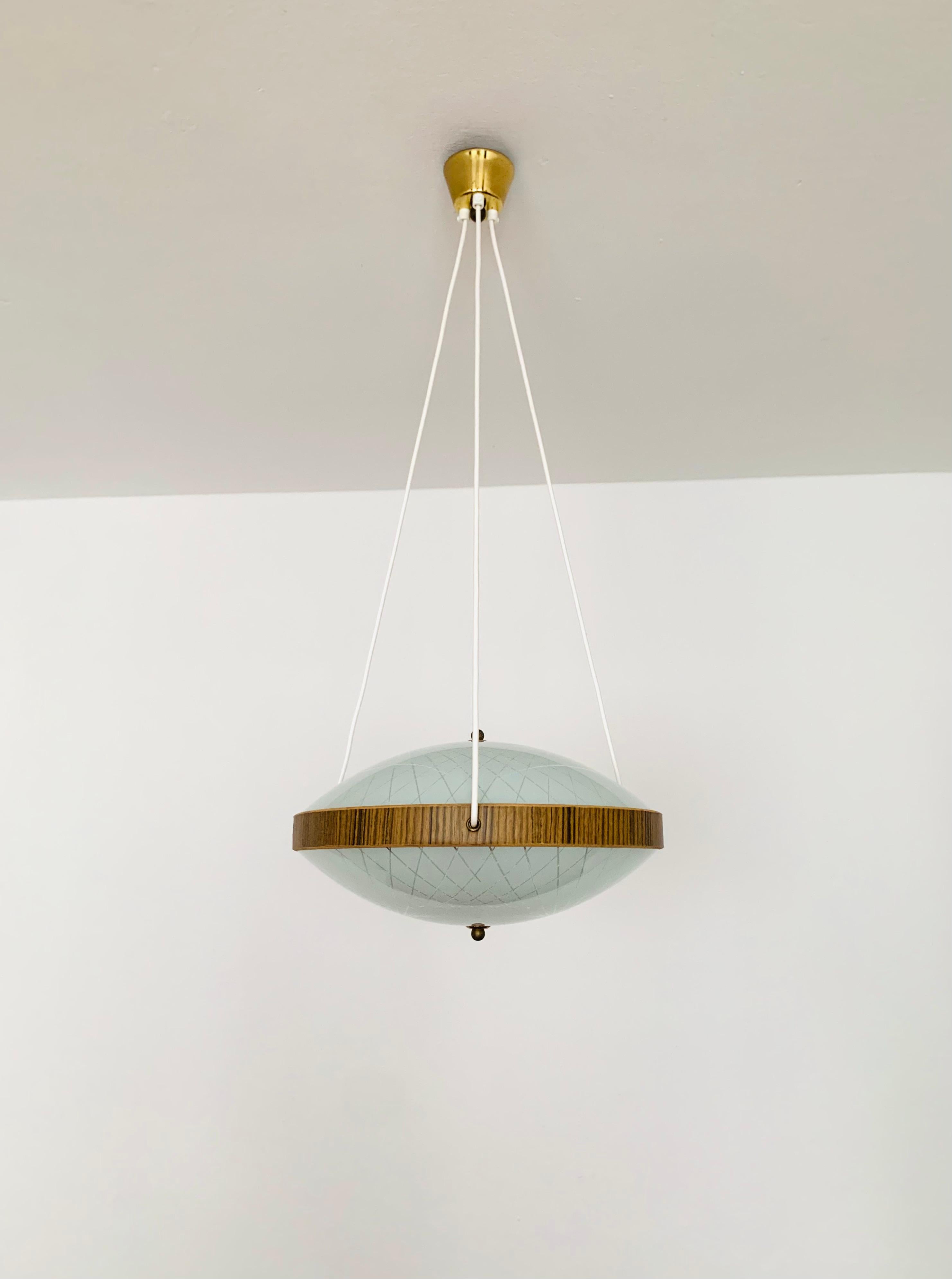 Exceptionally beautiful pendant lamp from the 1950s.
The great pattern in the glasses spreads a sparkling light.
Very fine and beautiful design which fits wonderfully into any room.

Condition:

Very good vintage condition with slight signs of
