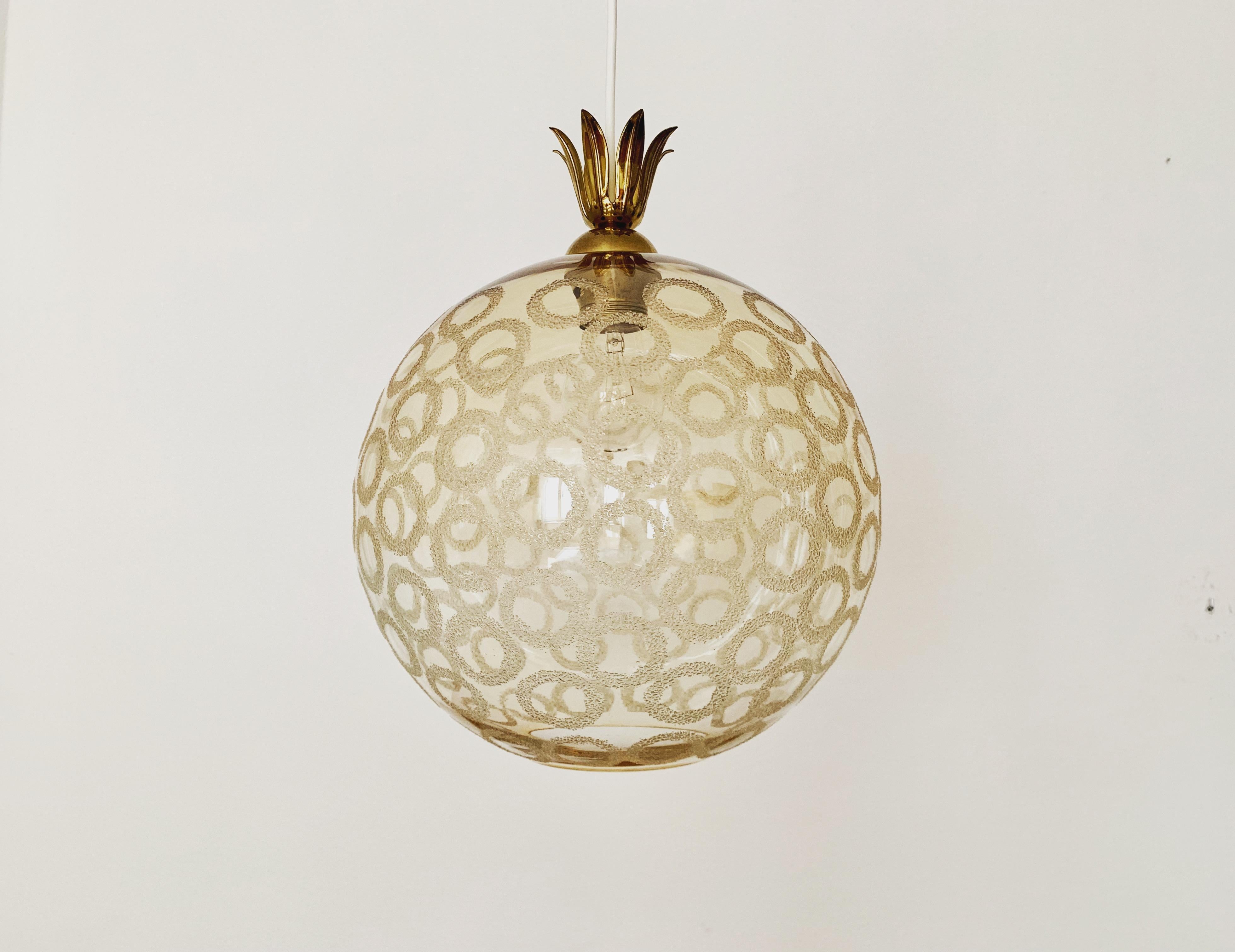 Very nice bubble glass pendant lamp from the 1950s.
The lamp makes a great play of light in the room and enchants with its charisma.
Extraordinary design with lovely details.

Condition:

Very good vintage condition with slight signs of wear
