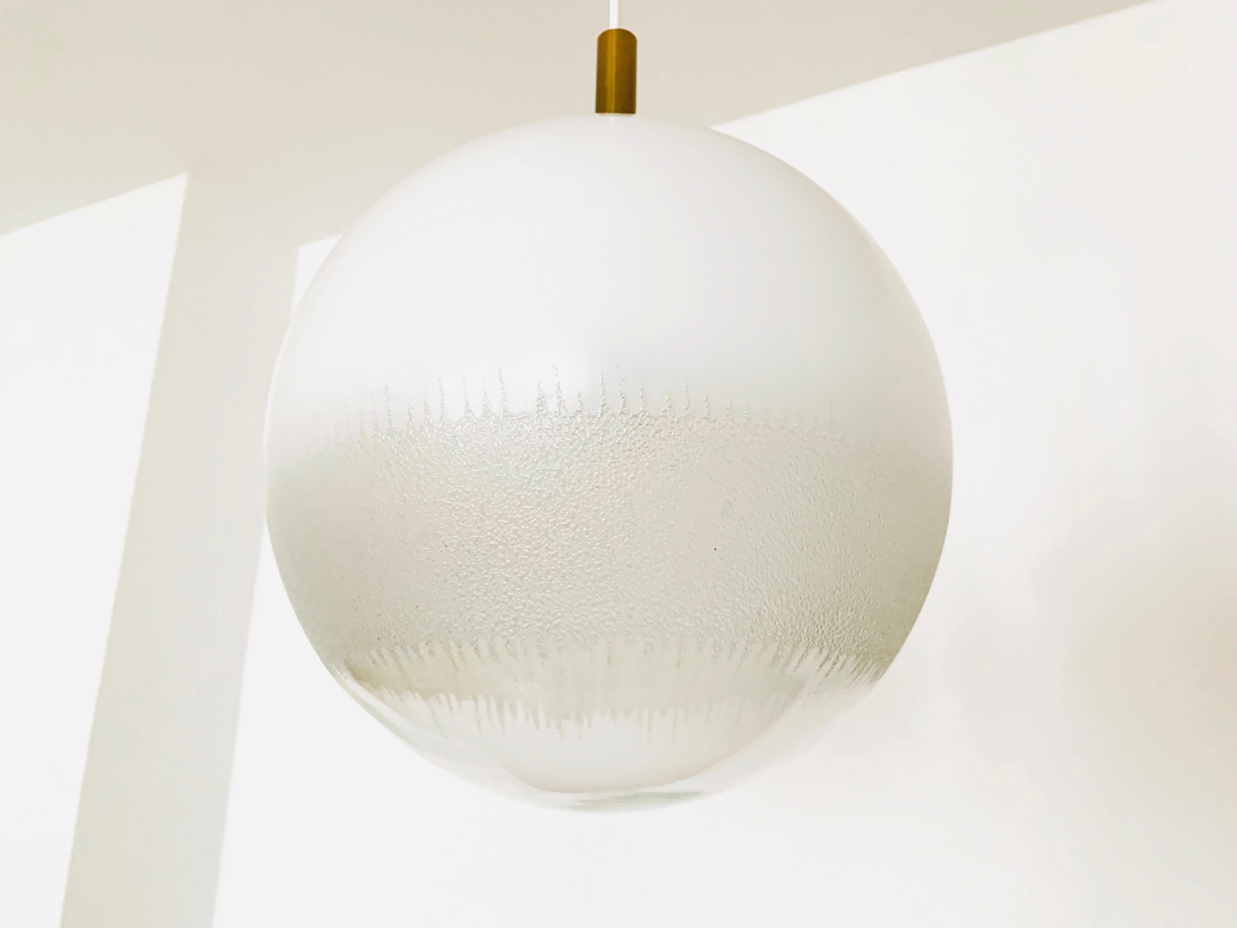 Exceptionally beautiful pendant lamp from the 1960s.
Very fine and beautiful design which fits wonderfully into any room.
The three-colored glass creates a beautiful and very comfortable light.

Condition:

Very good vintage condition with