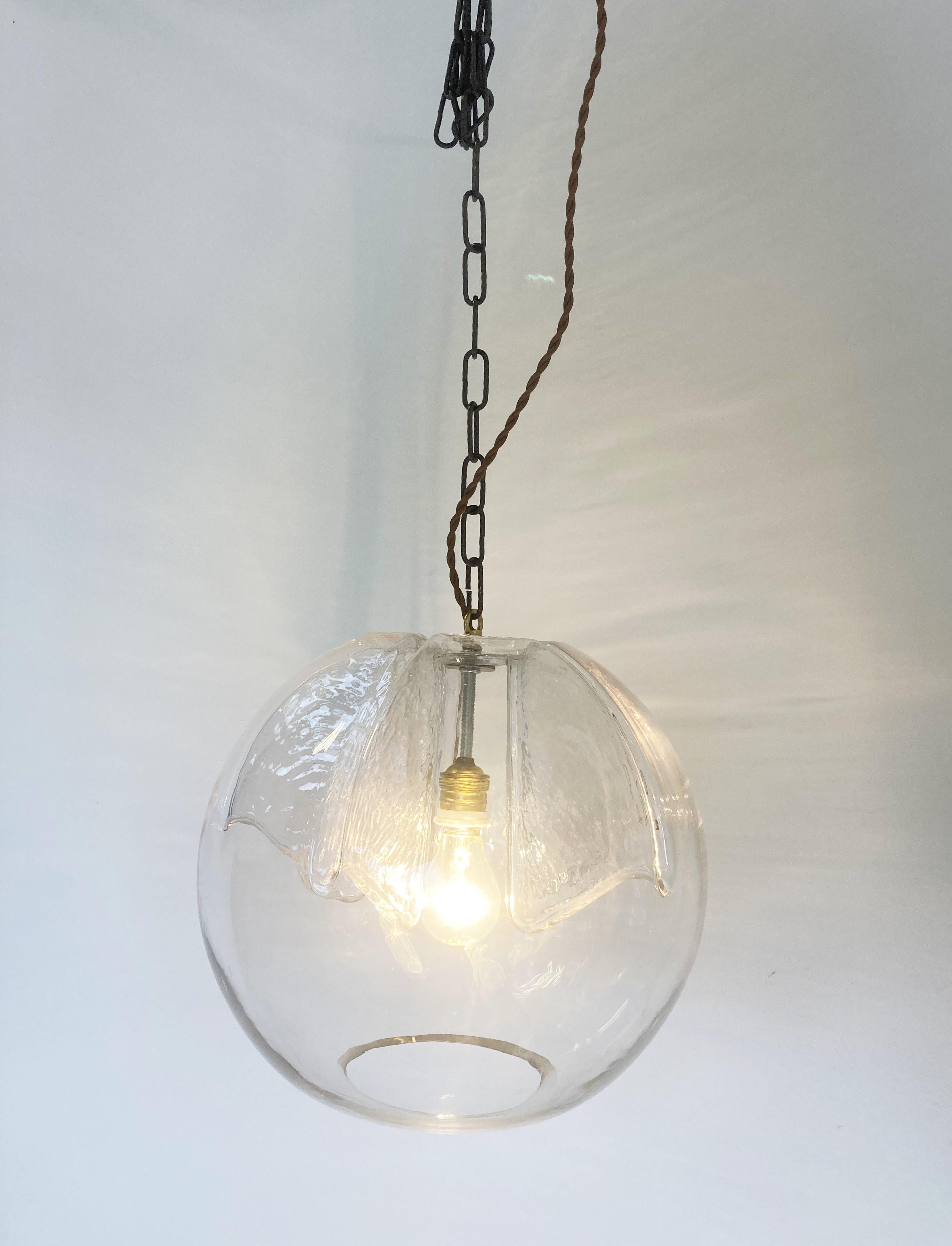 Vintage glass pendant light by Peil and Putzler.

The lamp emits a beautiful light thanks to its carefully designed glass.

Works with a regular E26/E27 light bulb, US compatible.

1970s - Germany

Dimensions:
height: 35cm/13.77
