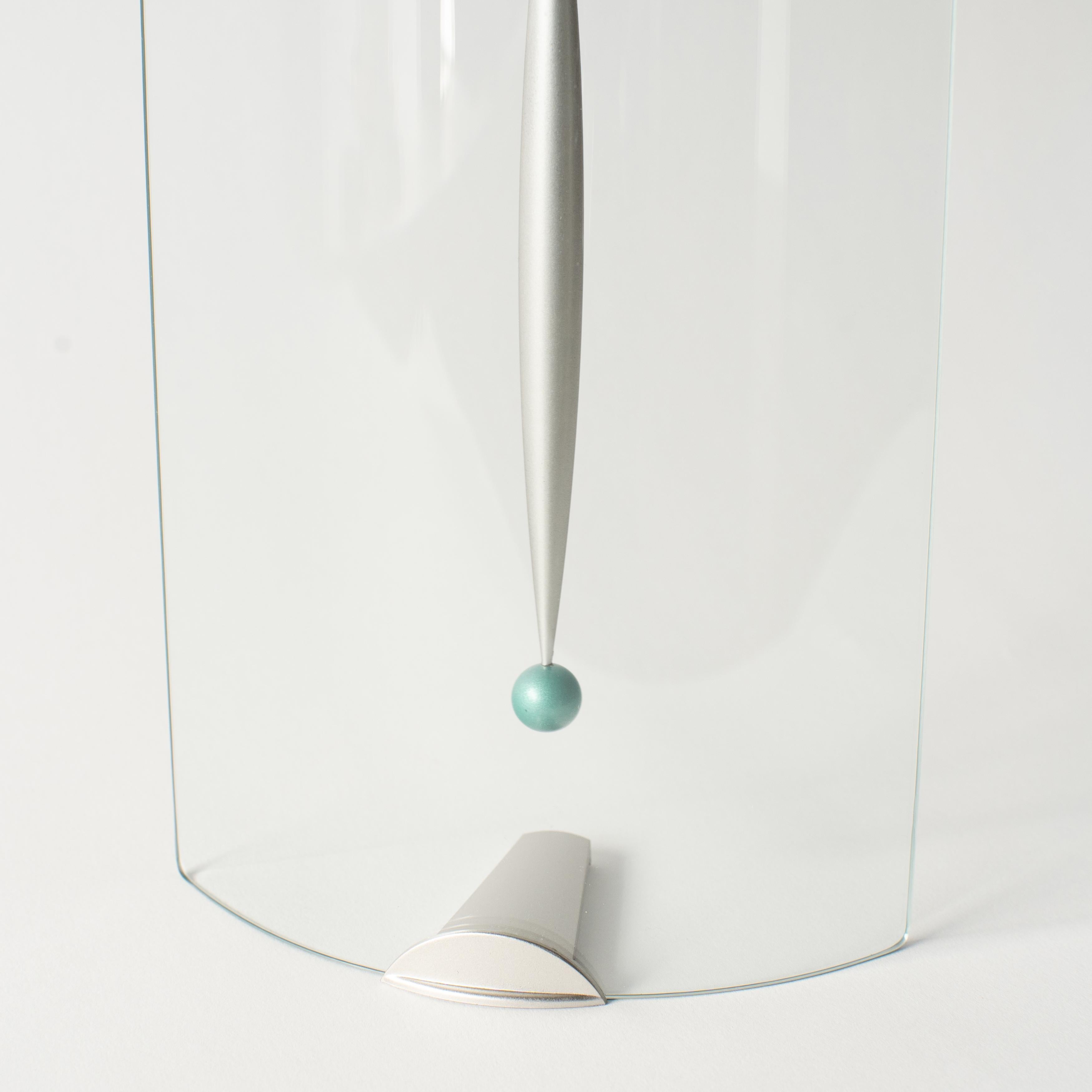 glass wall clock with pendulum