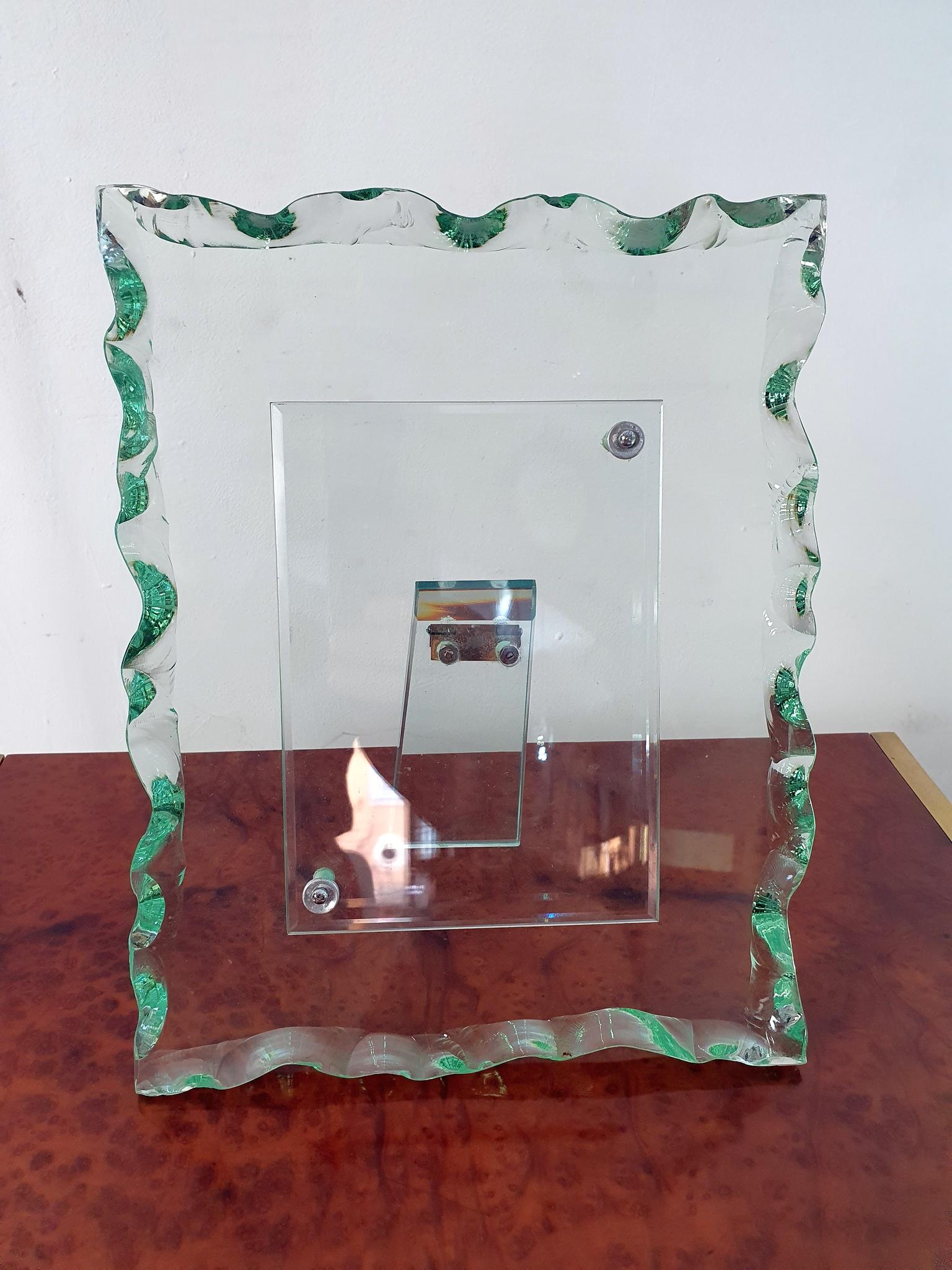 Crystal photo frame attributed to Pietro Chiesa for Fontana Arte, Italy. Produced sometime during the 1940s. The entire frame including the backrest is made in the typical green glass that has become synonymous with Fontana Arte. The measurement of