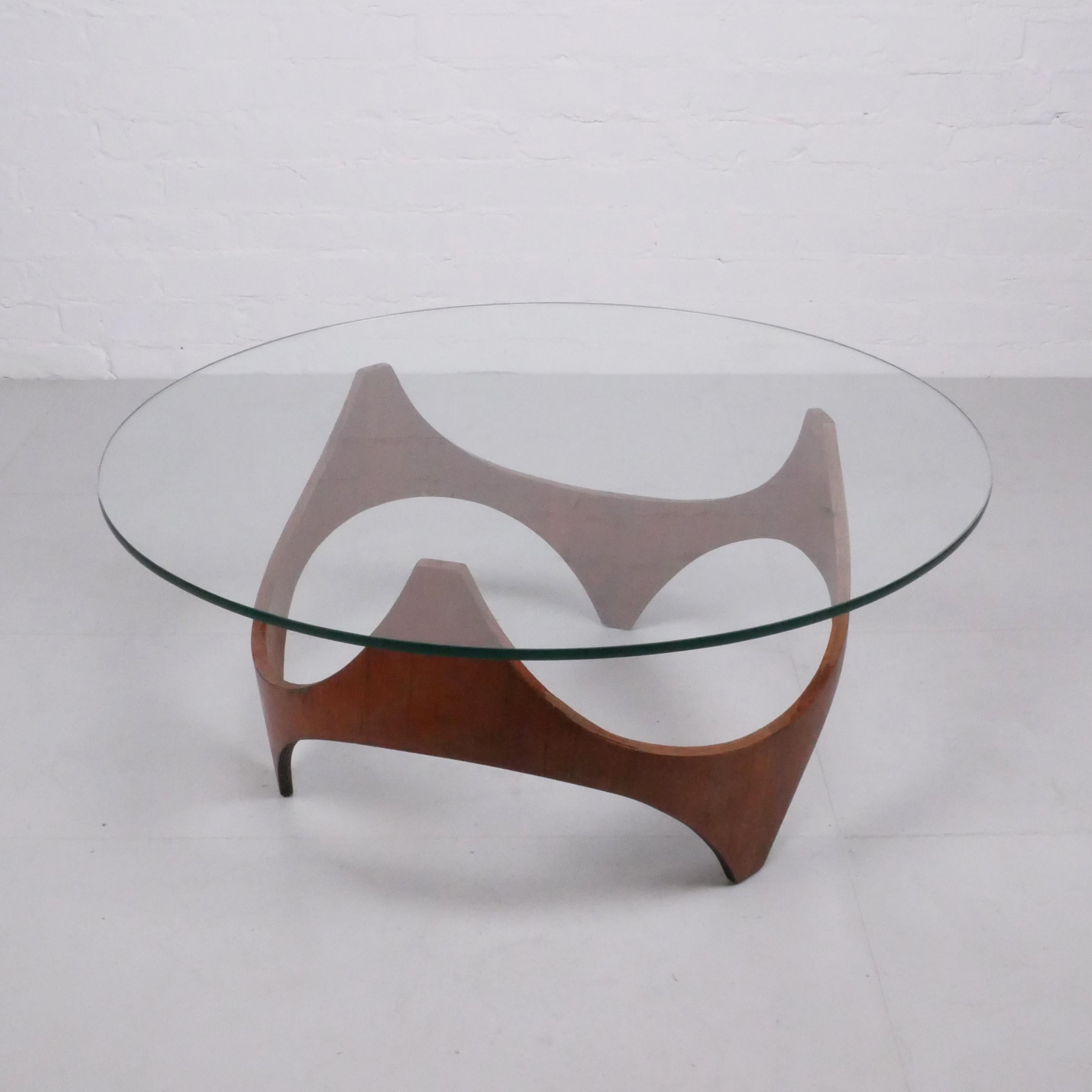 Henry P Glass (Designer), Austria/USA (attributed to / in the style of)
Coffee table, c. 1960

Teak veneered plywood, glass top.

Stunning, dynamic low table. The design is sometimes attributed to the Austrian/American architect/designer Henry