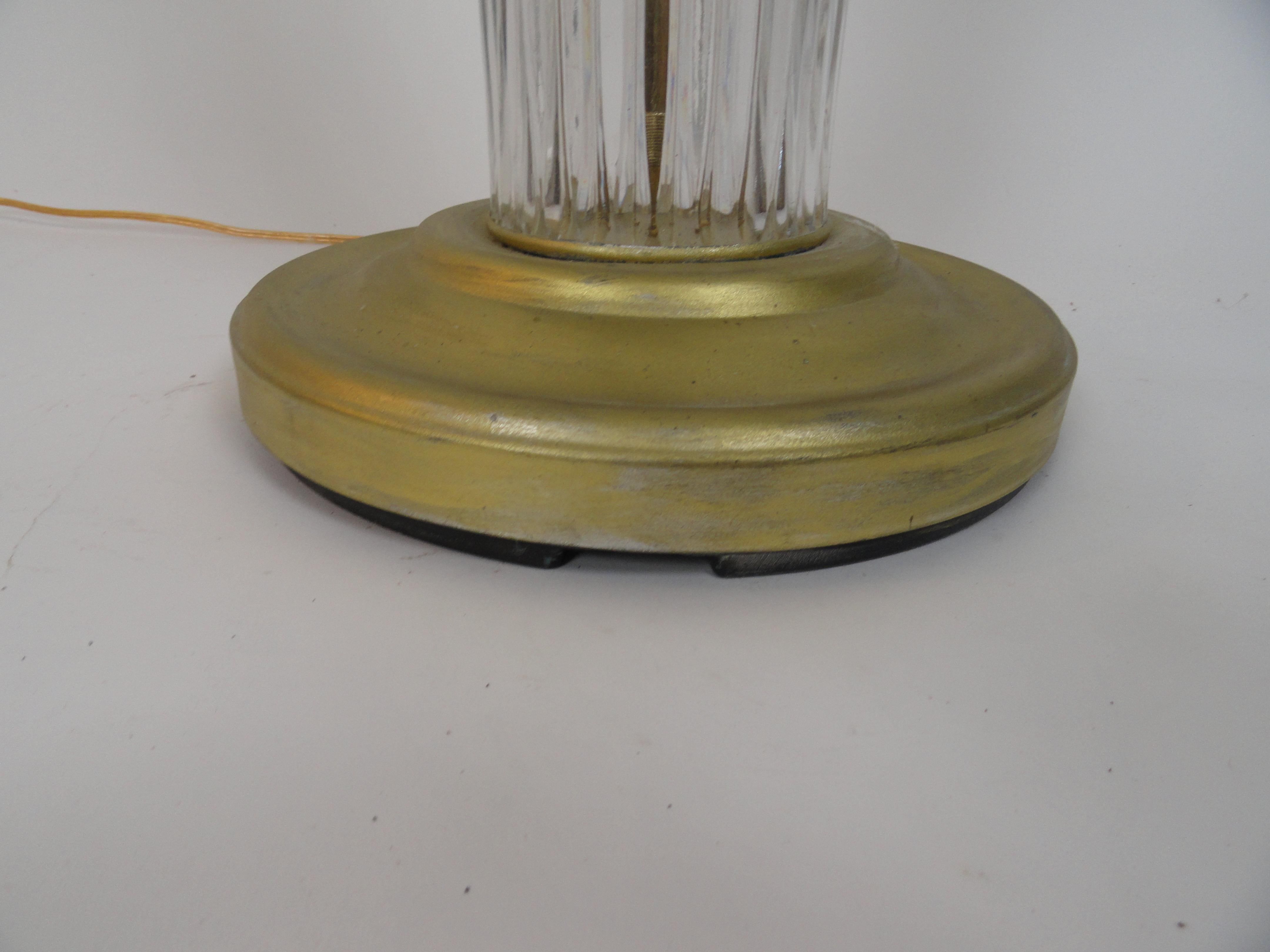Faceted glass American pole lamp with leafed metal base.