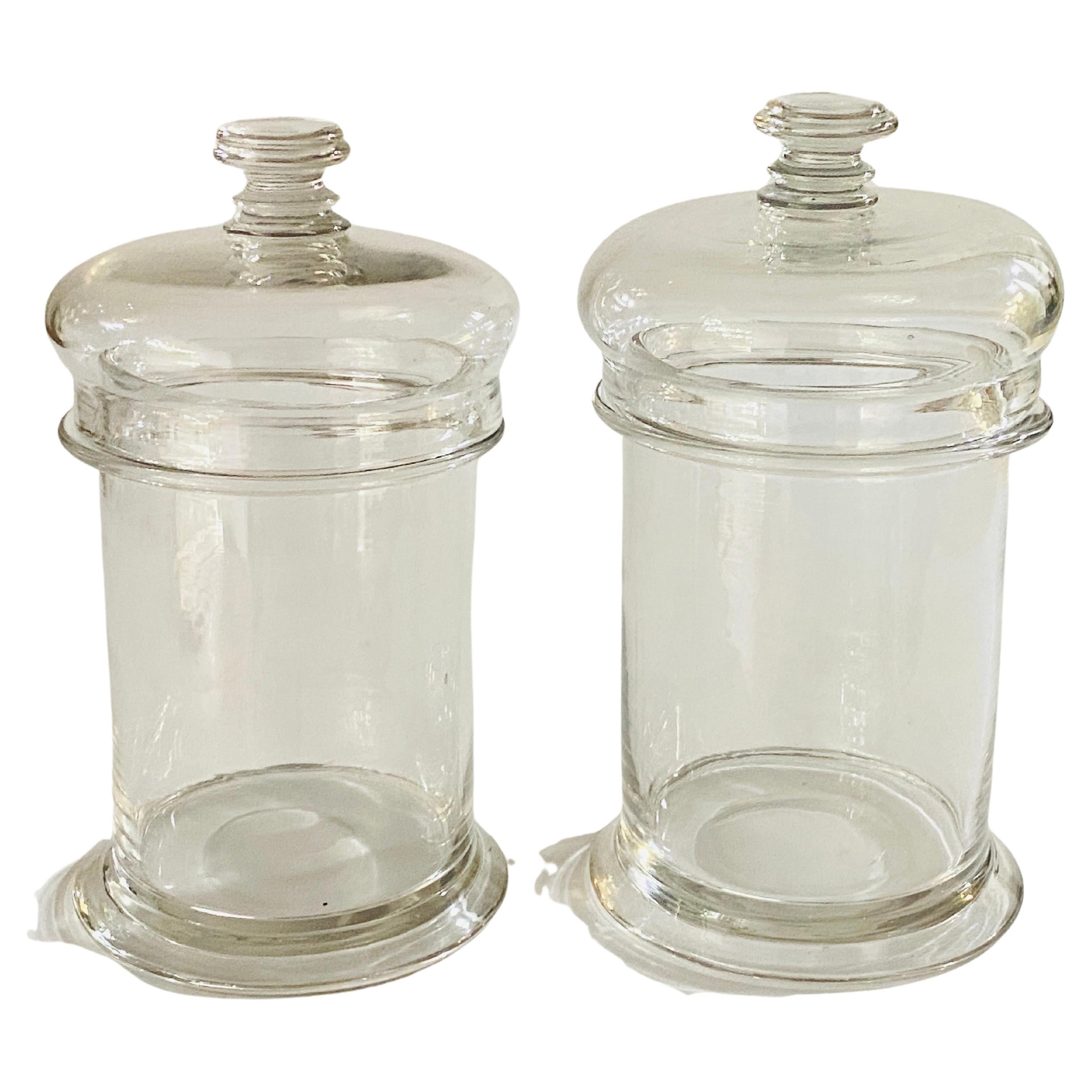 These Glass pot are in Glass. They have a glass lid too. The condition is Good It has been done in France, circa 1970.
Canbe used as bottle, boxes or Pot.