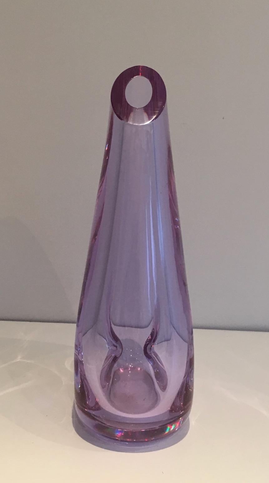This vase is ma de of a glass purplish-colored pear-shaped. This is a French work. Circa 1970.