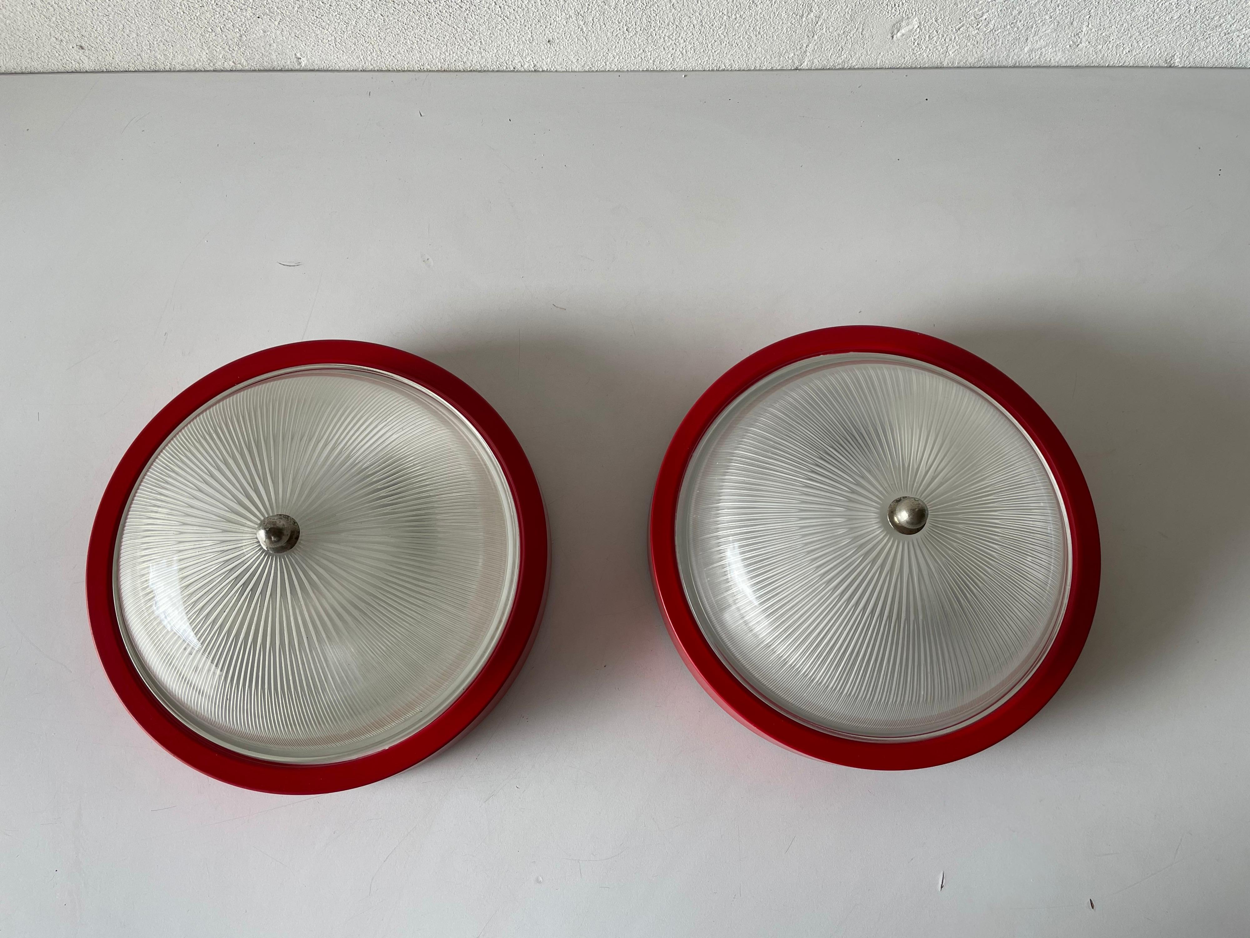 Space Age Glass Red Metal Base Pair of Sconces or Ceiling Lamps by Reggiani, 1970s, Italy For Sale