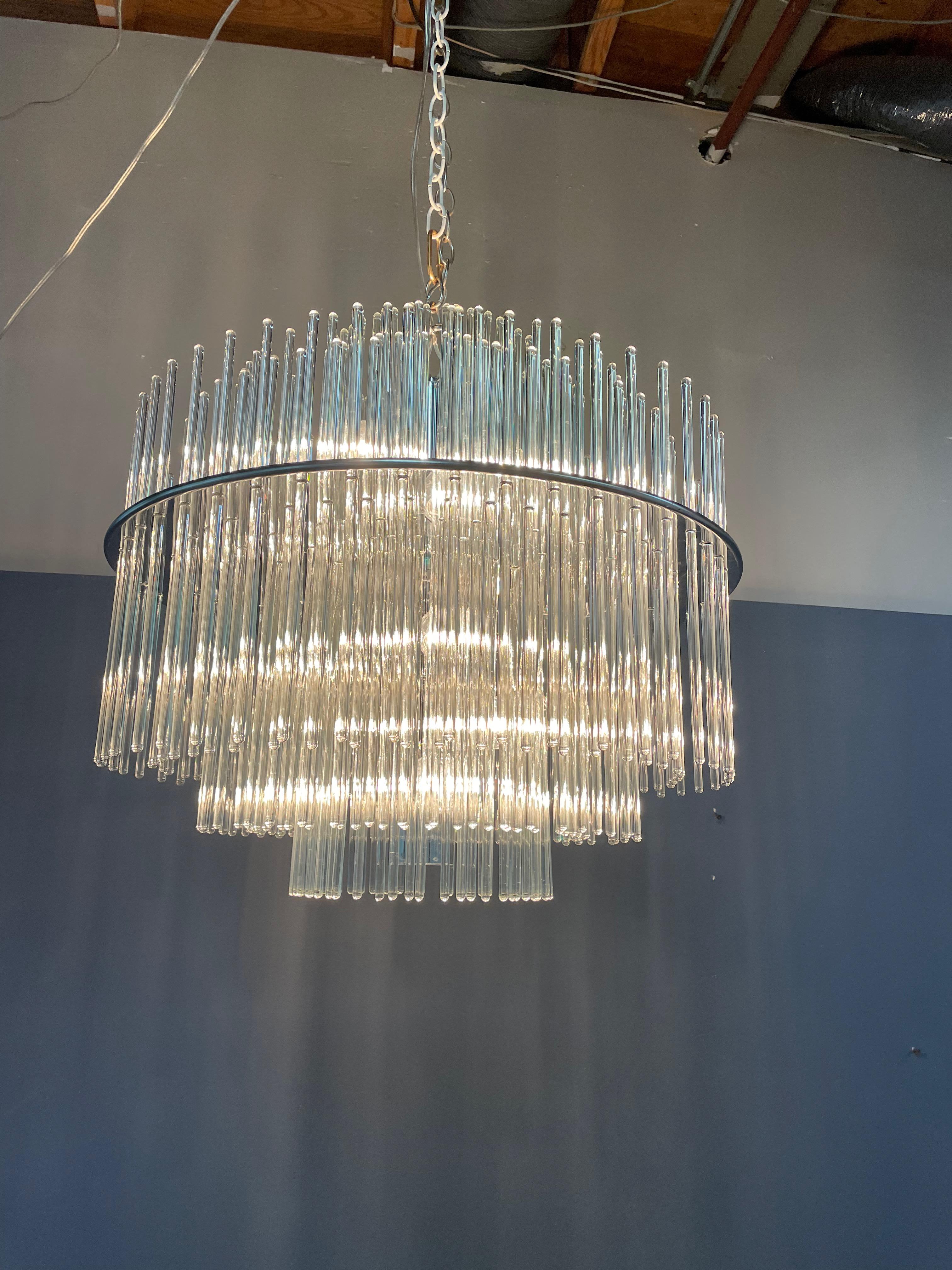 Midcentury glass rod two tier chandelier in the manor of Sciolari. Beautiful glass rods sit on a nickel frame giving off a cascading affect. Has been rewired for America use. All of the rods are in perfect condition with a few extra.