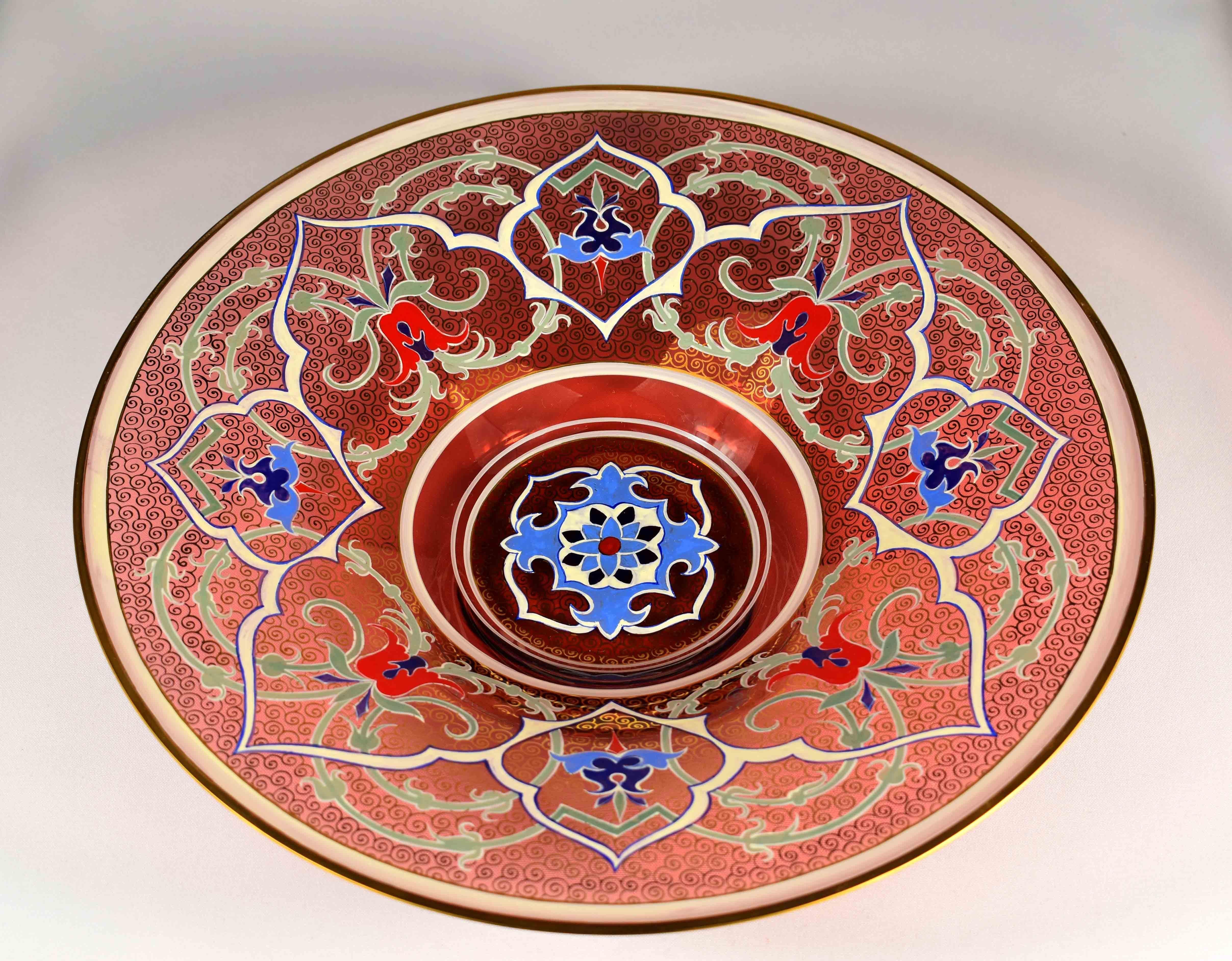 Hand blown ruby and clear glass plate, made by Czech glassmakers in the 20th century for the Persian or Ottoman market, beautiful ruby red design with impressive enameling and gilding, gilt enamel rim, circular body finely painted all around rich