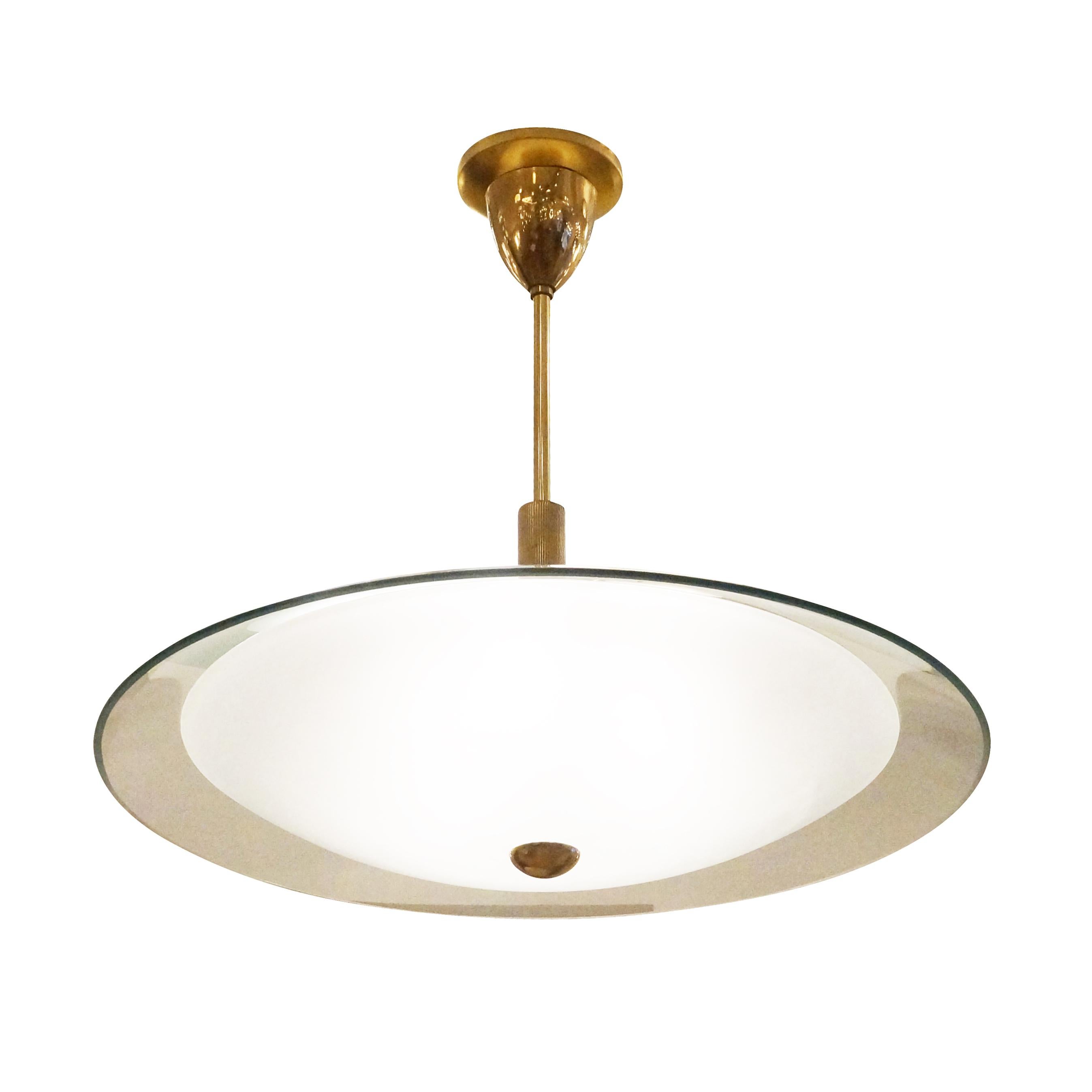 1960’s Fontana Arte style chandelier with a clear glass upper diffuser and smaller frosted glass lower diffuser. Brass hardware-holds three light sources. 

Condition: Excellent vintage condition, minor wear consistent with age and use.

Diameter: