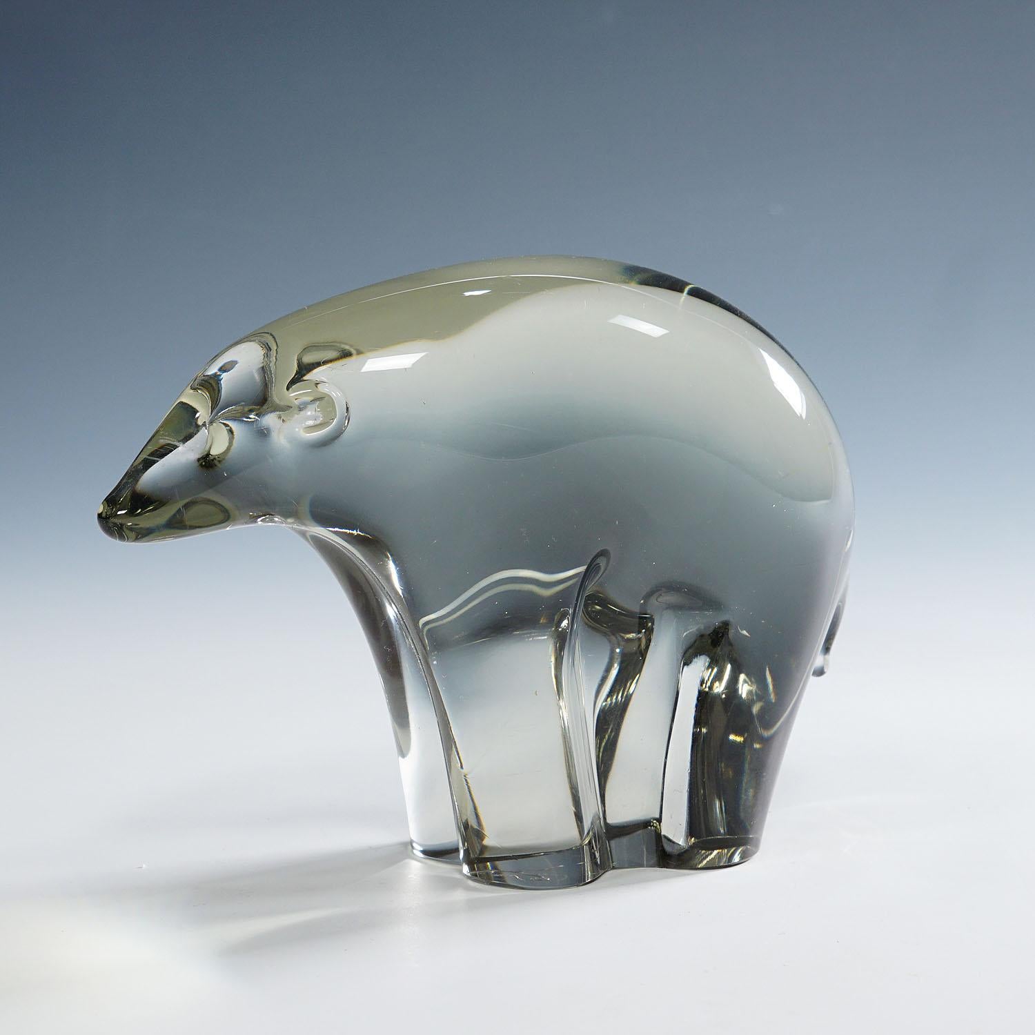 Glass Sculpture of an Ice Bear Designed by Livio Seguso ca. 1970s
Item e7123
A powerful sculpture of a stylized ice bear in smoke grey glass. The bear is hand made in the Graal glass manufactory, Germany. It was designed by Livio Seguso ca. 1970.