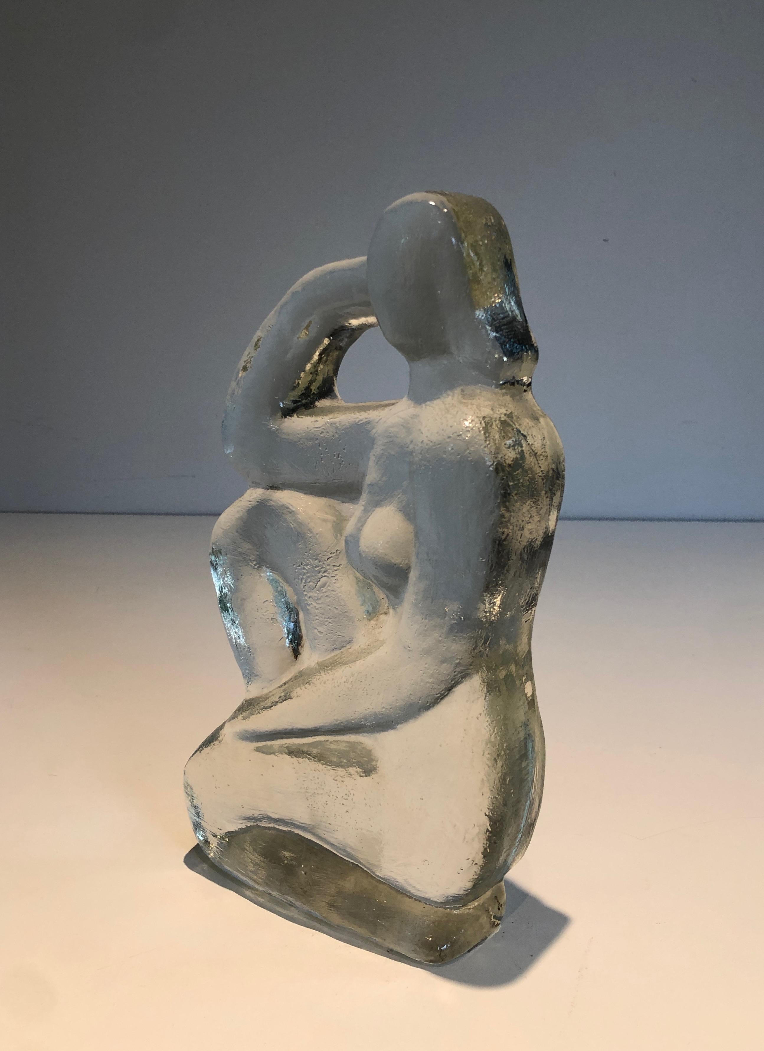 This very nice sculpture representing a naked woman posing is all made of glass. This is a French work in the Art Deco style. Circa 1970