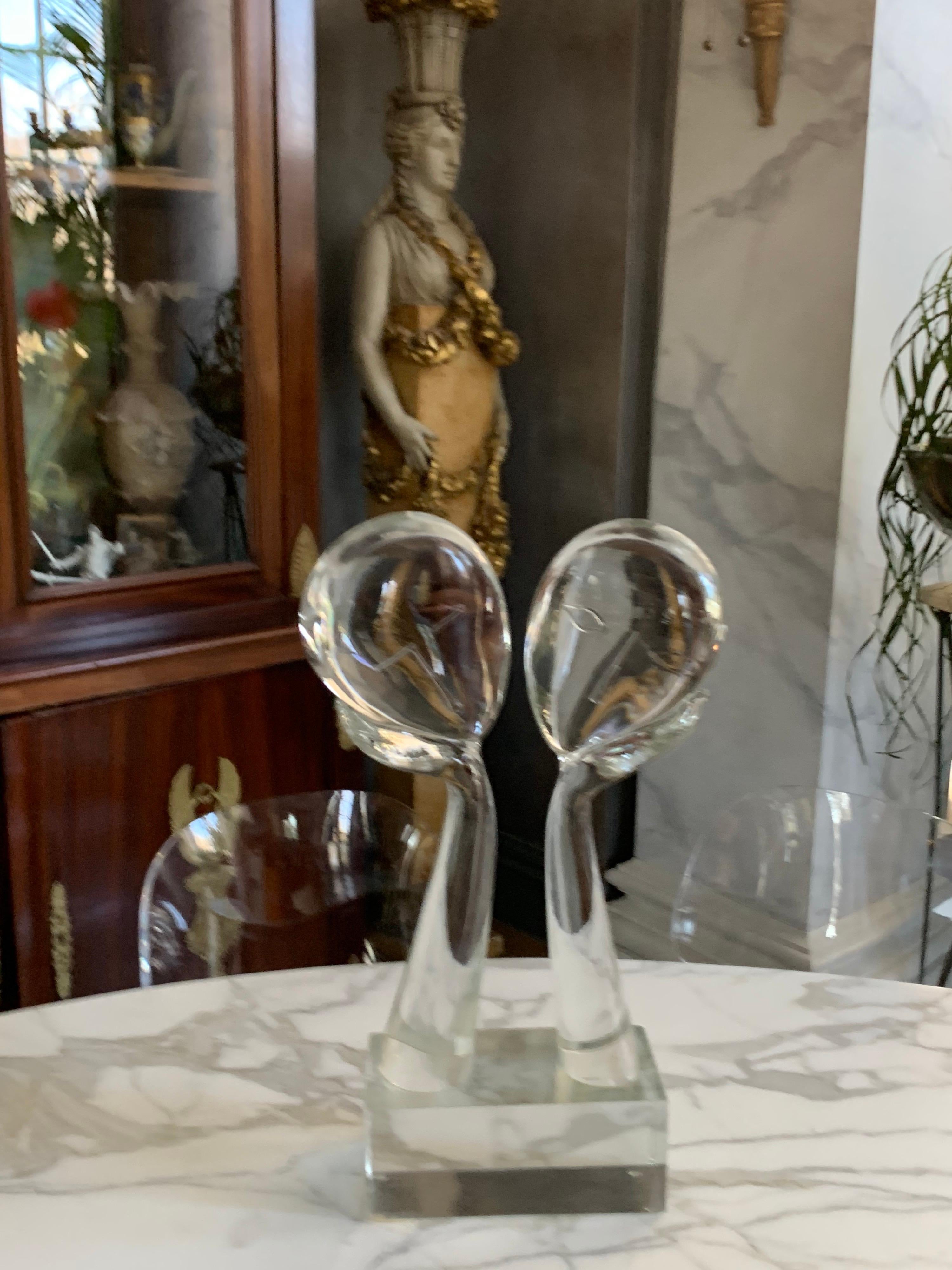 This Loredano rosin glass sculpture called “2 Faces” was made circa 1984.
Made of clear Murano glass in Italy.
Loredano Rosin (1936-19991) was a famous glass artist working with the likes such as Marc Chagall and Pablo Picasso. 

Loredano Rosin