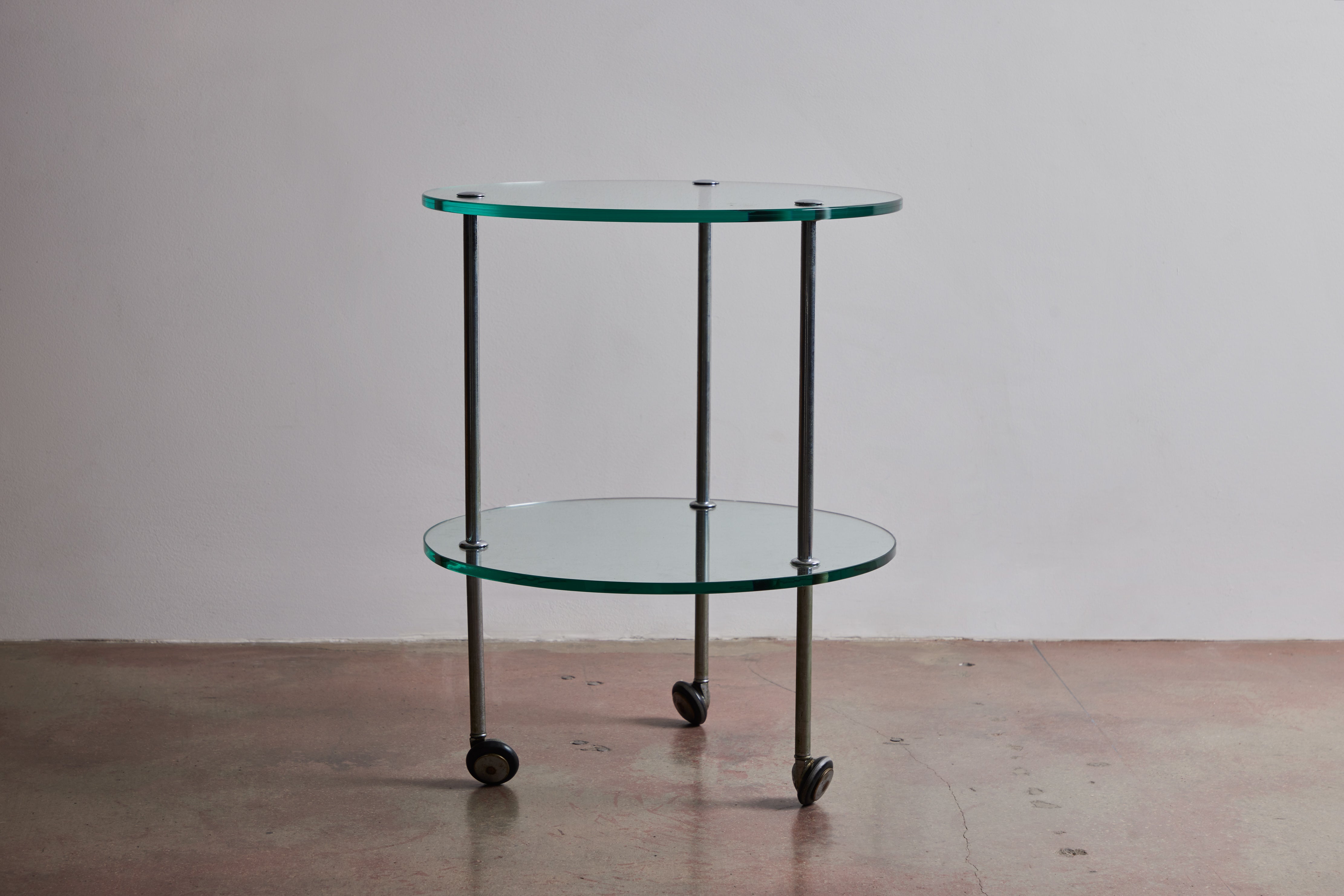 Occasional table in nickel plated brass and glass by Corrado Corradi dell’Acqua for Azucena. Made in Italy circa 1950s.
