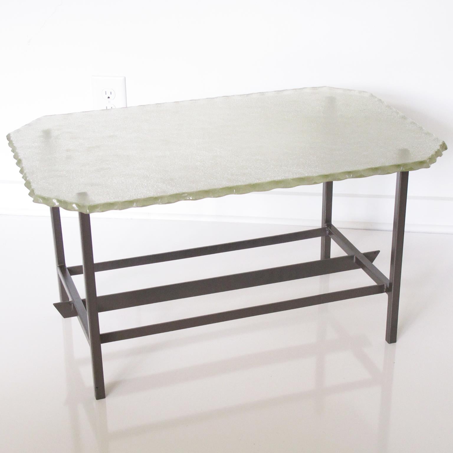 Make a bold statement with this exquisite modernist glass and metal coffee table, a rare creation attributed to the legendary Pietro Chiesa for the esteemed Italian manufacturer Fontana Arte. Crafted in Italy circa 1940, this exceptional piece
