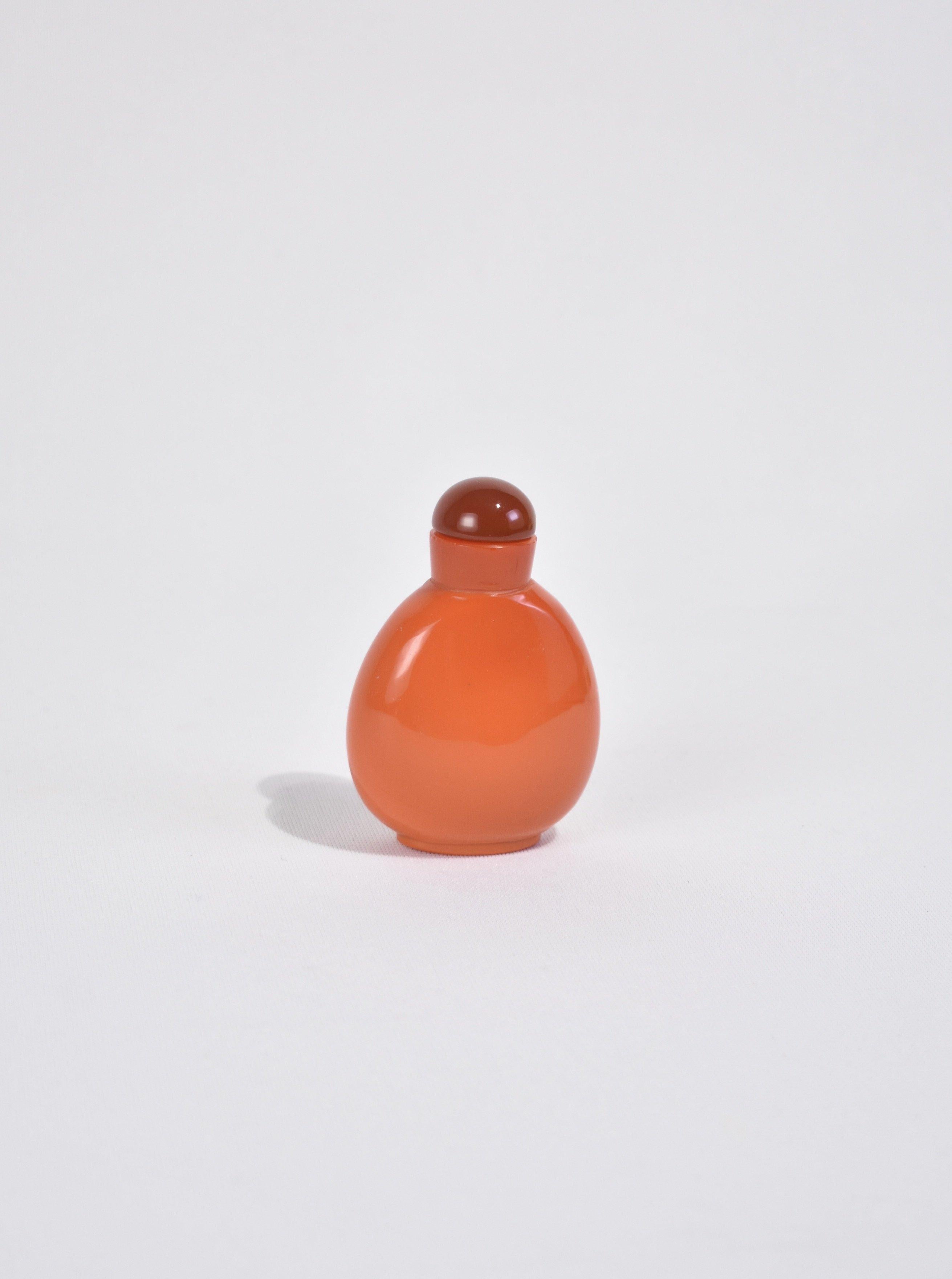Rare, carnelian red glass snuff bottle. Likely made by Imperial Glassworks for the Qing Dynasty. Ca. 1770 - 1900.