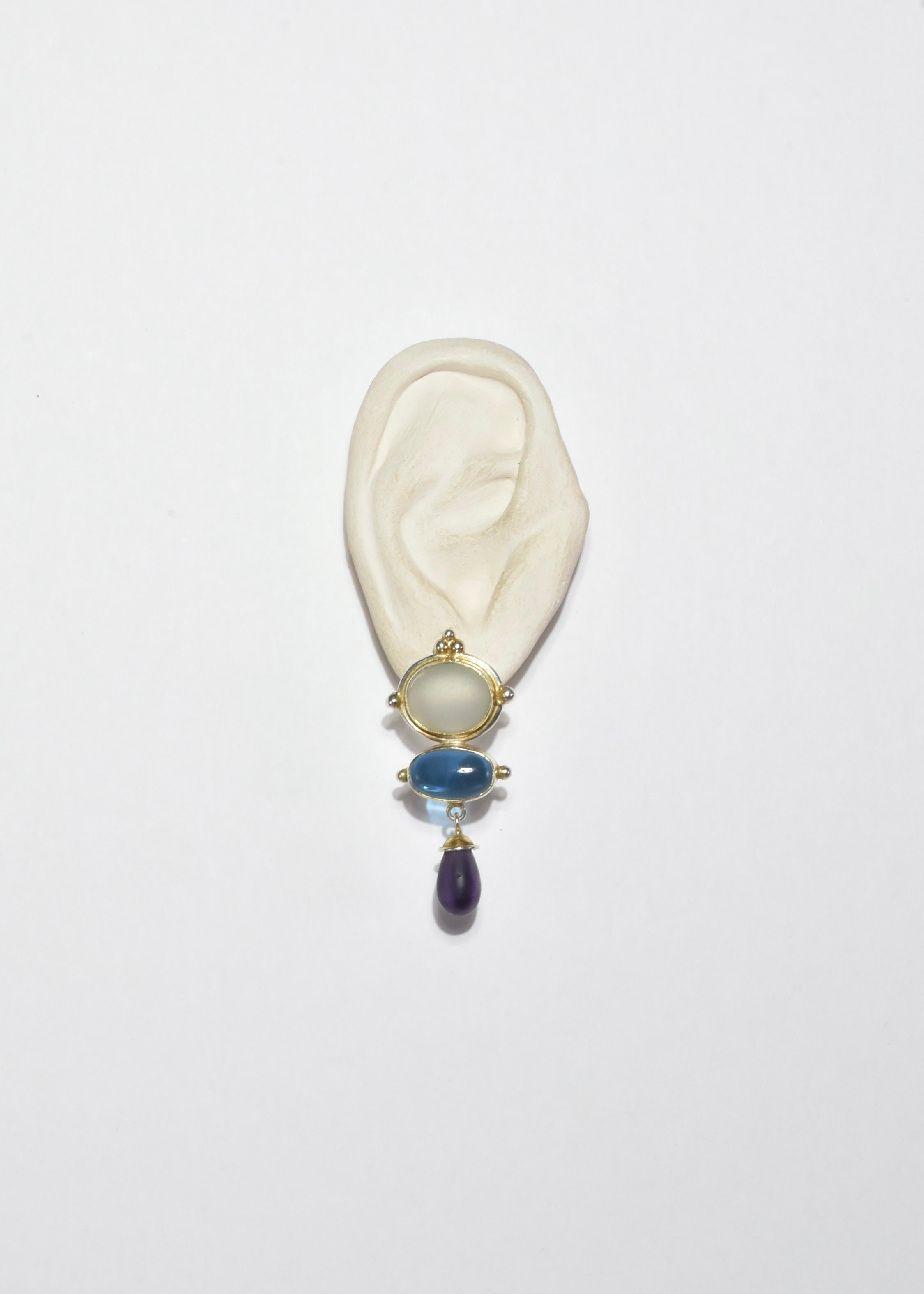 Stunning vintage vermeil earrings with blue, purple, and white glass detail, pierced. Stamped 925.

Material: Gold vermeil, glass.