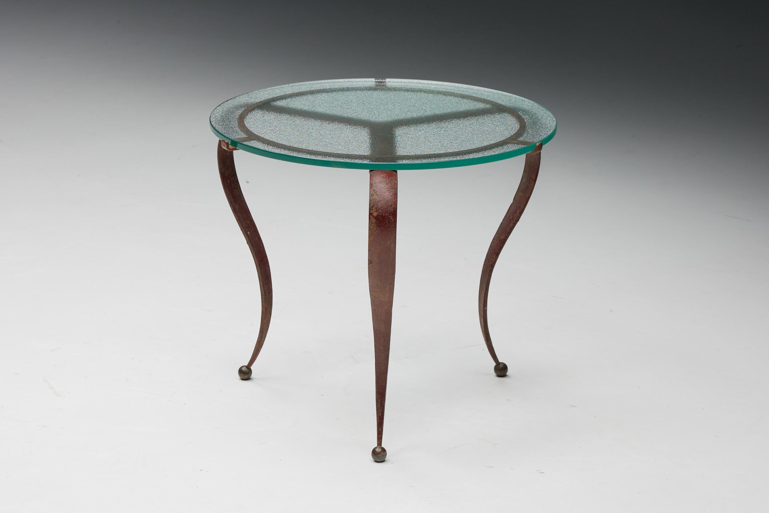 Glass; Steel; Coffee Table; René Drouet; 1940s; France; French Design; 

Jean Royere style, rare occasional Art Deco side table by René Drouet, France, circa 1940s. Crepi glass top on iron base. Measures: Ø 48 cm, H 39 cm.
