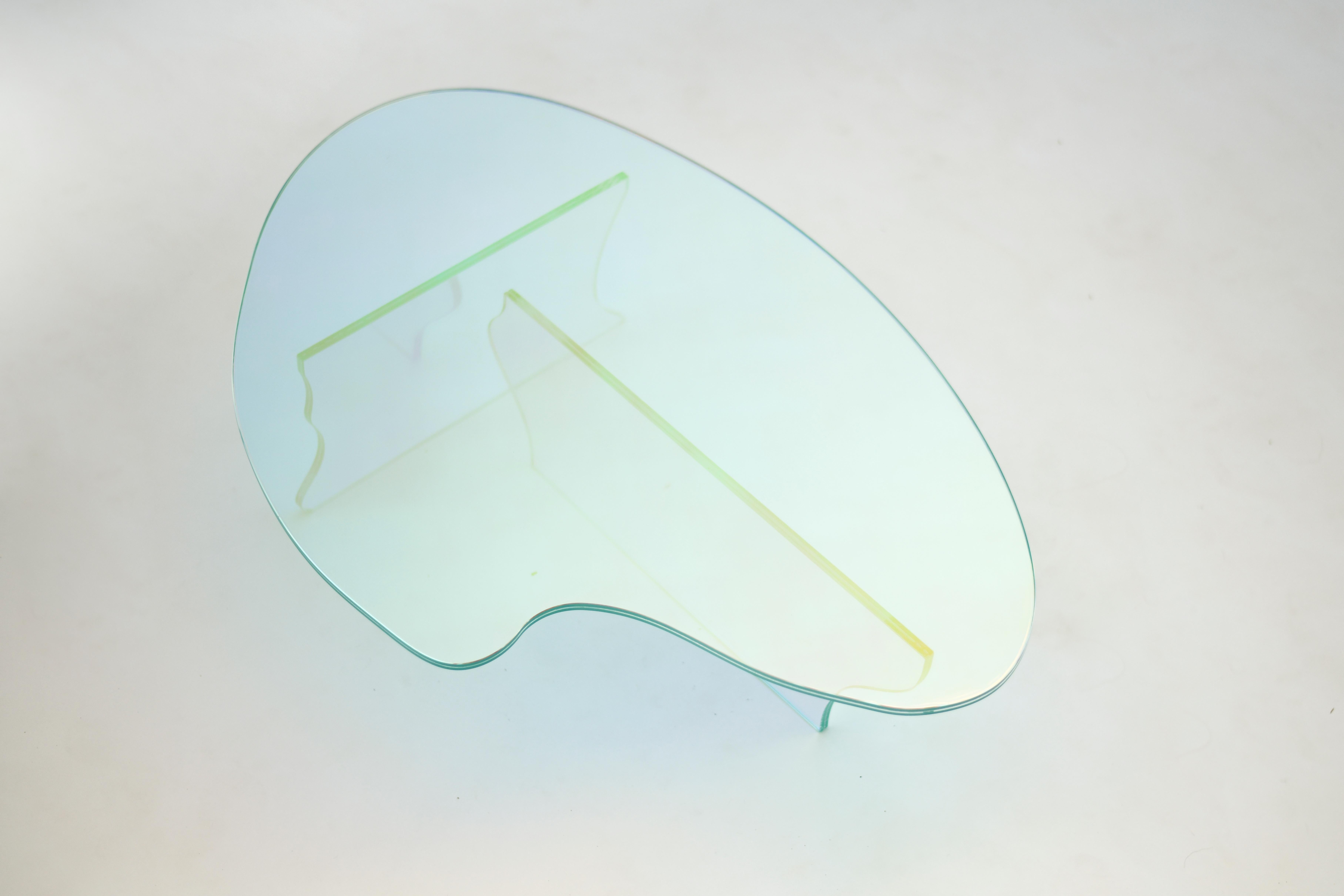 Glass table by Brajak Vitberg
Materials: Glass, dichroic film
Dimensions: 86 x 58 x 20 cm

Bijelic and Brajak are two architects from Ljubljana, Slovenia.
They are striving to design craft elements and make them timeless through experimental
