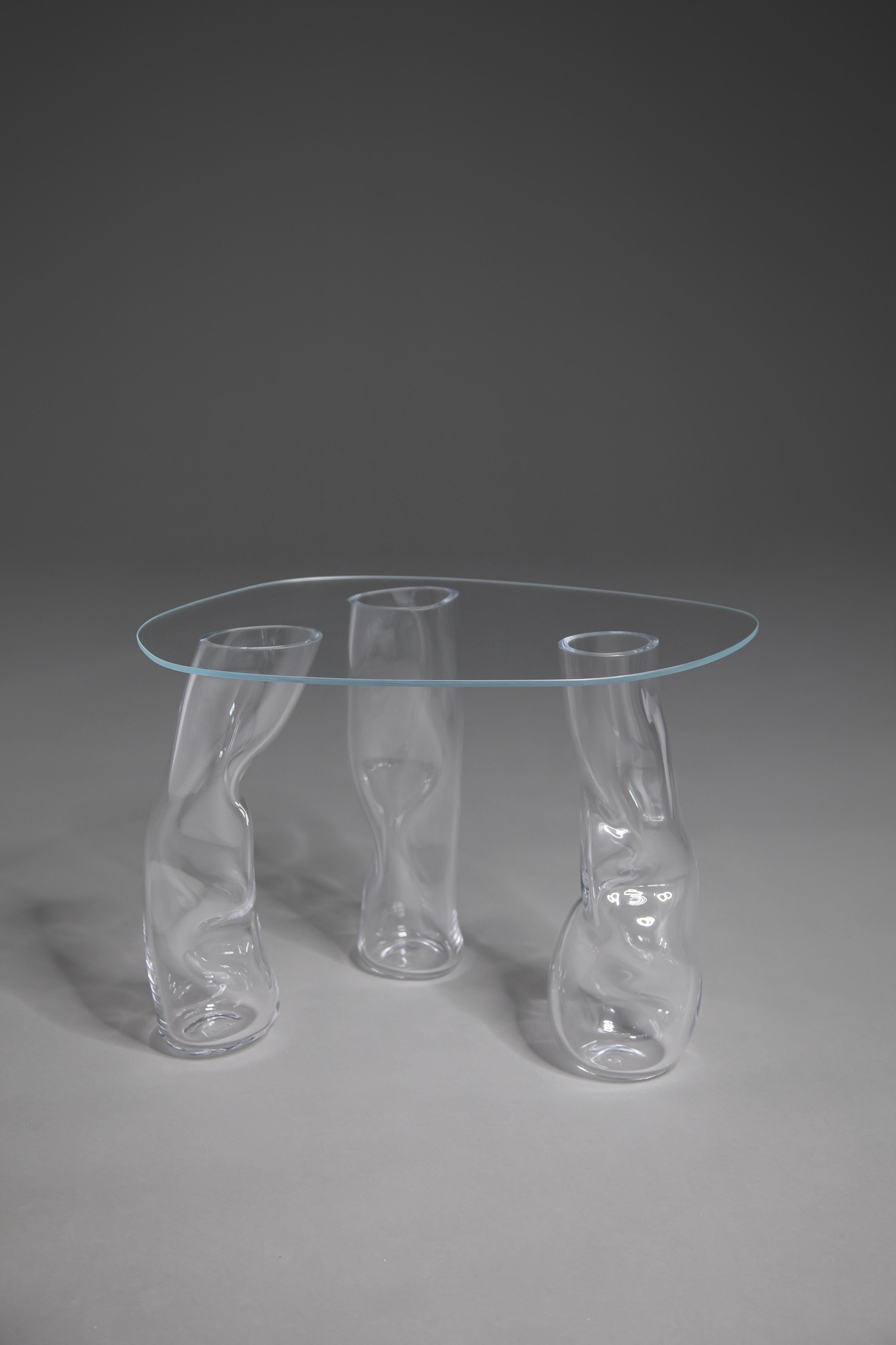Clara Jorisch glass tables are made of blown glass and are UV glued. All tables are uniques - reminiscent of the glassblower gesture that gives each one its particular shape. 

Clara Jorisch is a designer and crafts(wo)man from Montreal. Clara’s