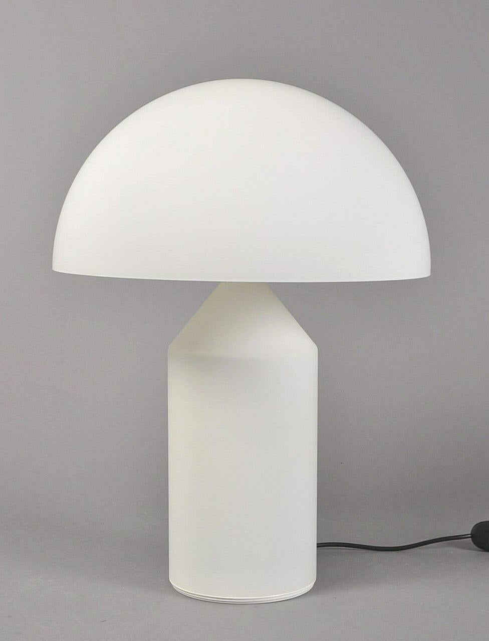 The Atollo table lamp (1977) is distinguished by its minimal geometric construction. The worldwide imitated and yet inimitable lamp won numerous awards, and it can also be found as a permanent exhibit in many museums around the world. The series